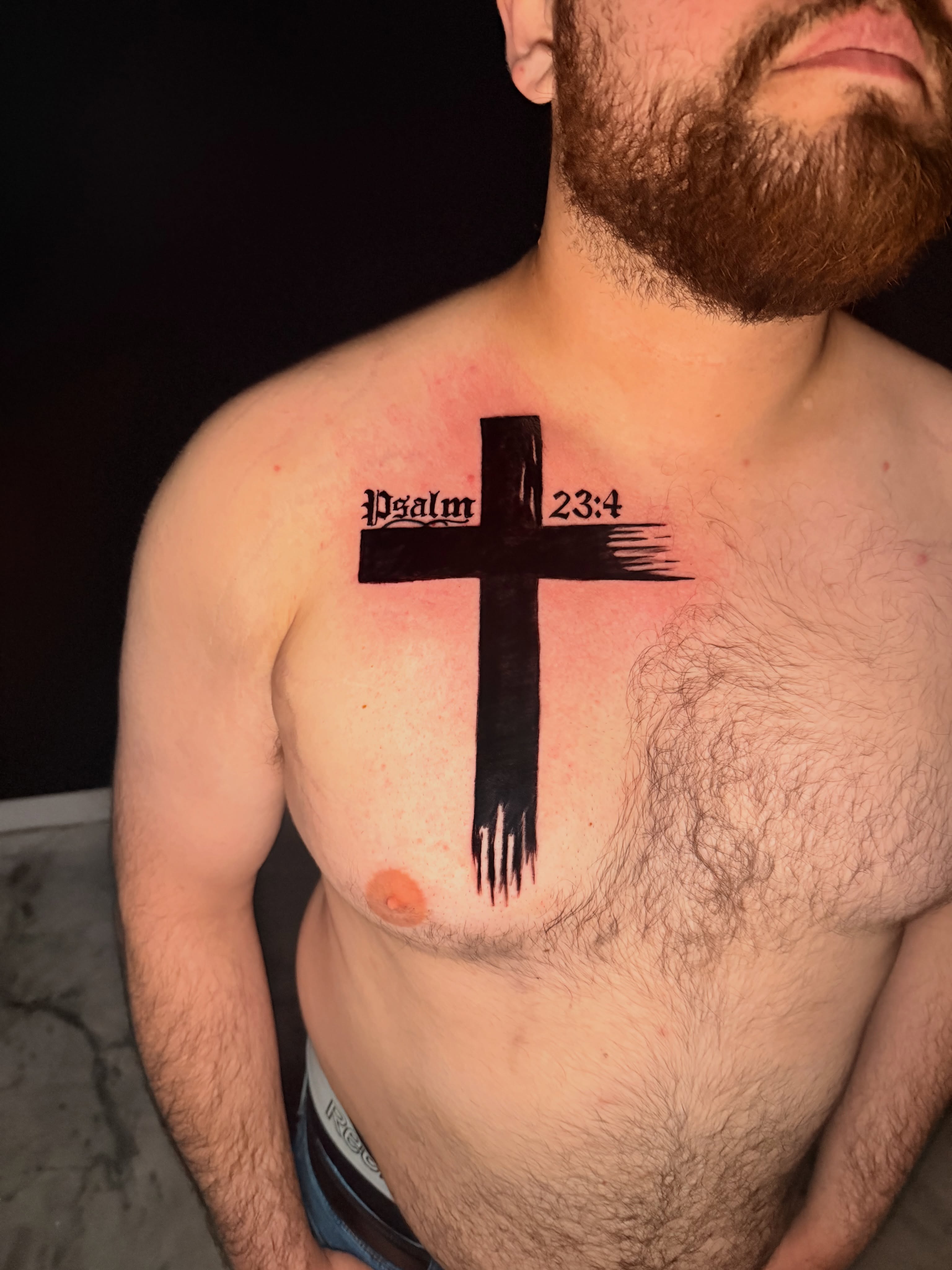 Cross black and grey tattoo on the chest by Junior Sanchez Dfw