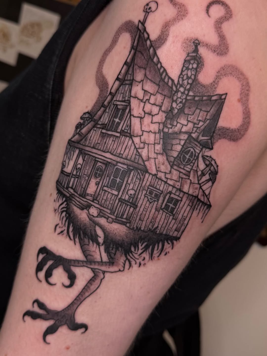 Haunted house on bird legs fine line tattoo on the forearm by Eden H., Columbus, Ohio