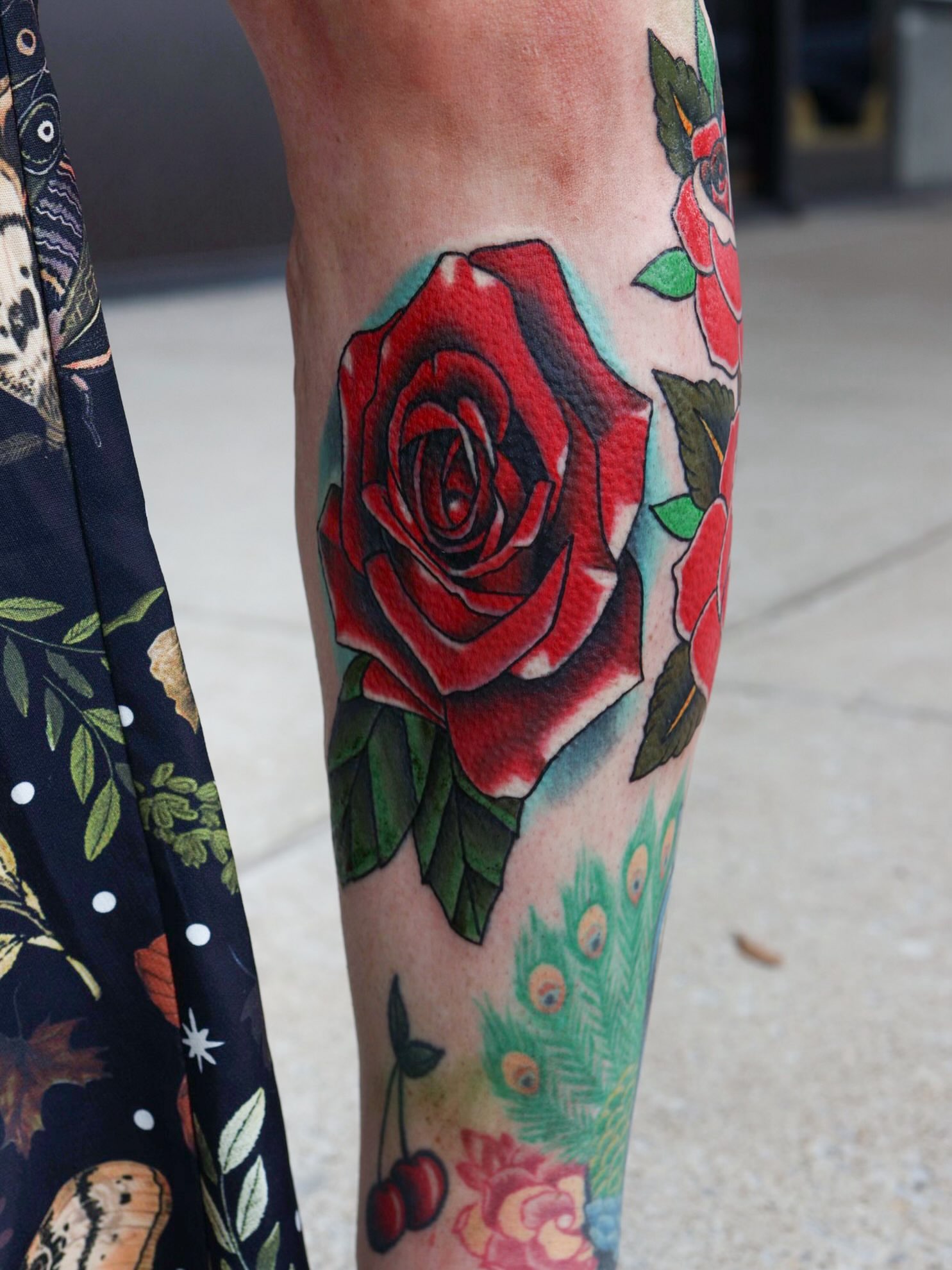 Red rose American traditional tattoo on the calf by Blake Owens, Nashville, Tennessee