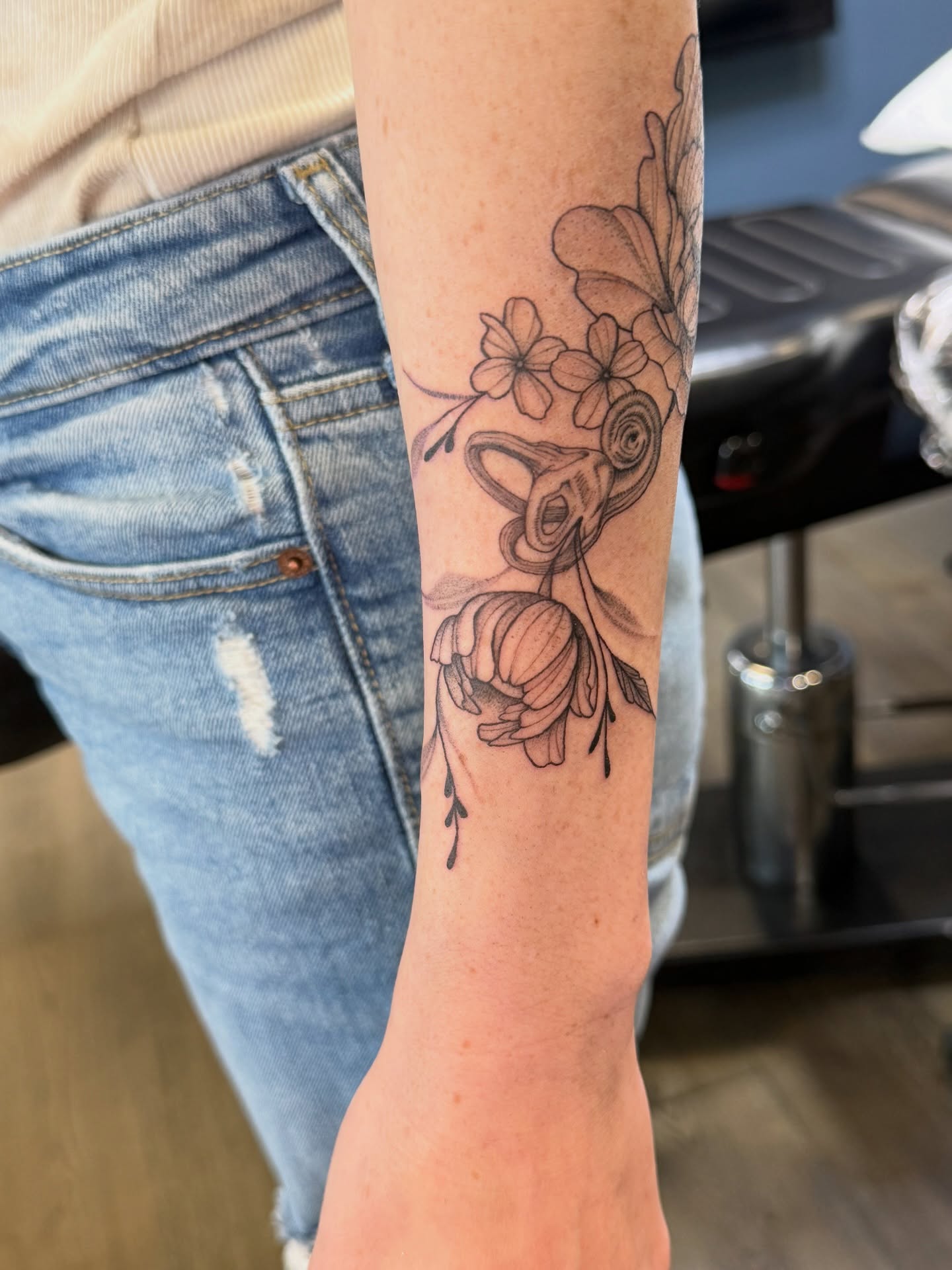 Flower and snake black and grey tattoo on the forearm by WhoisLaineyTattoos