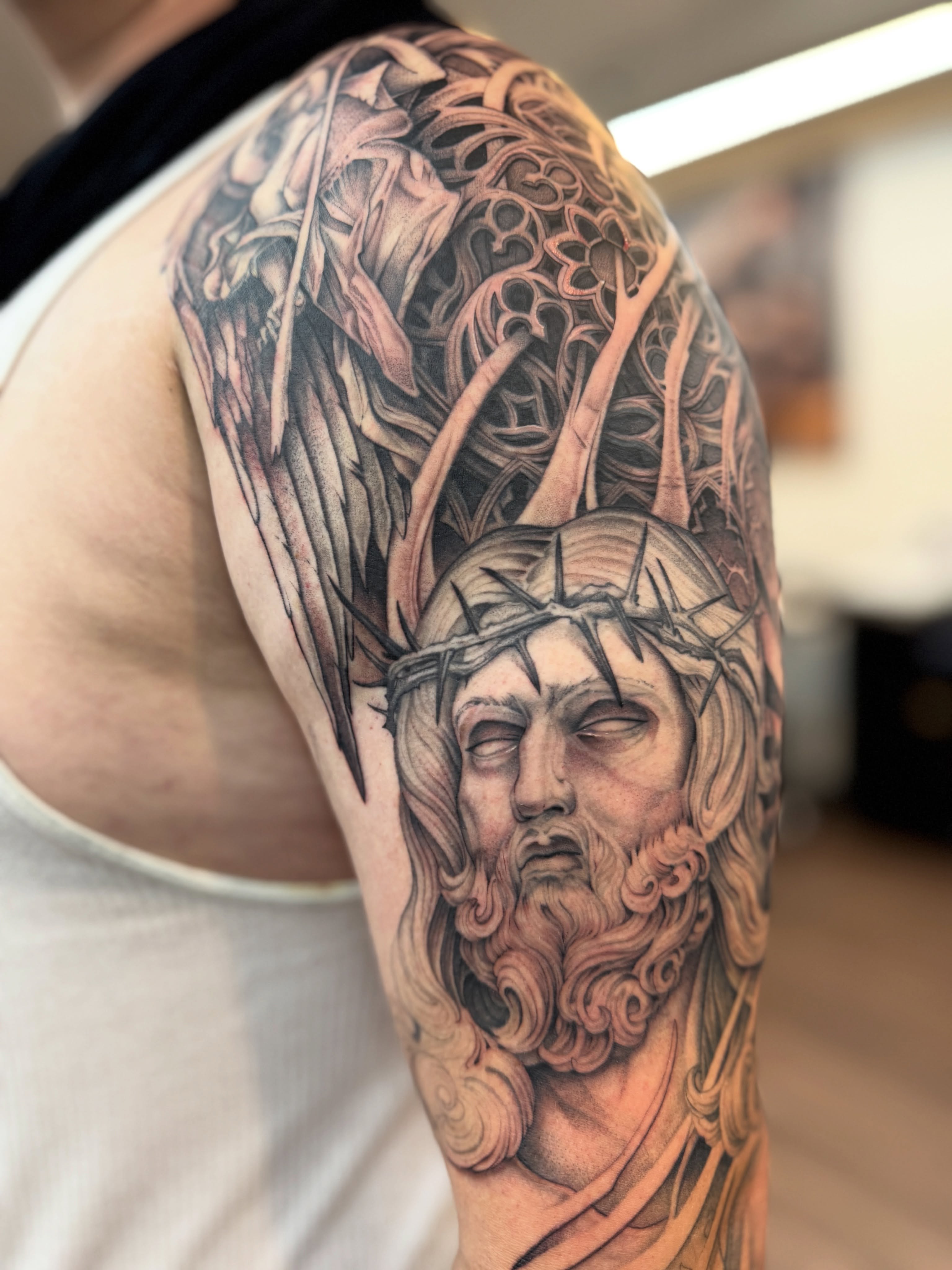 Jesus Christ portrait realism tattoo on the shoulder by Steve Franciosa