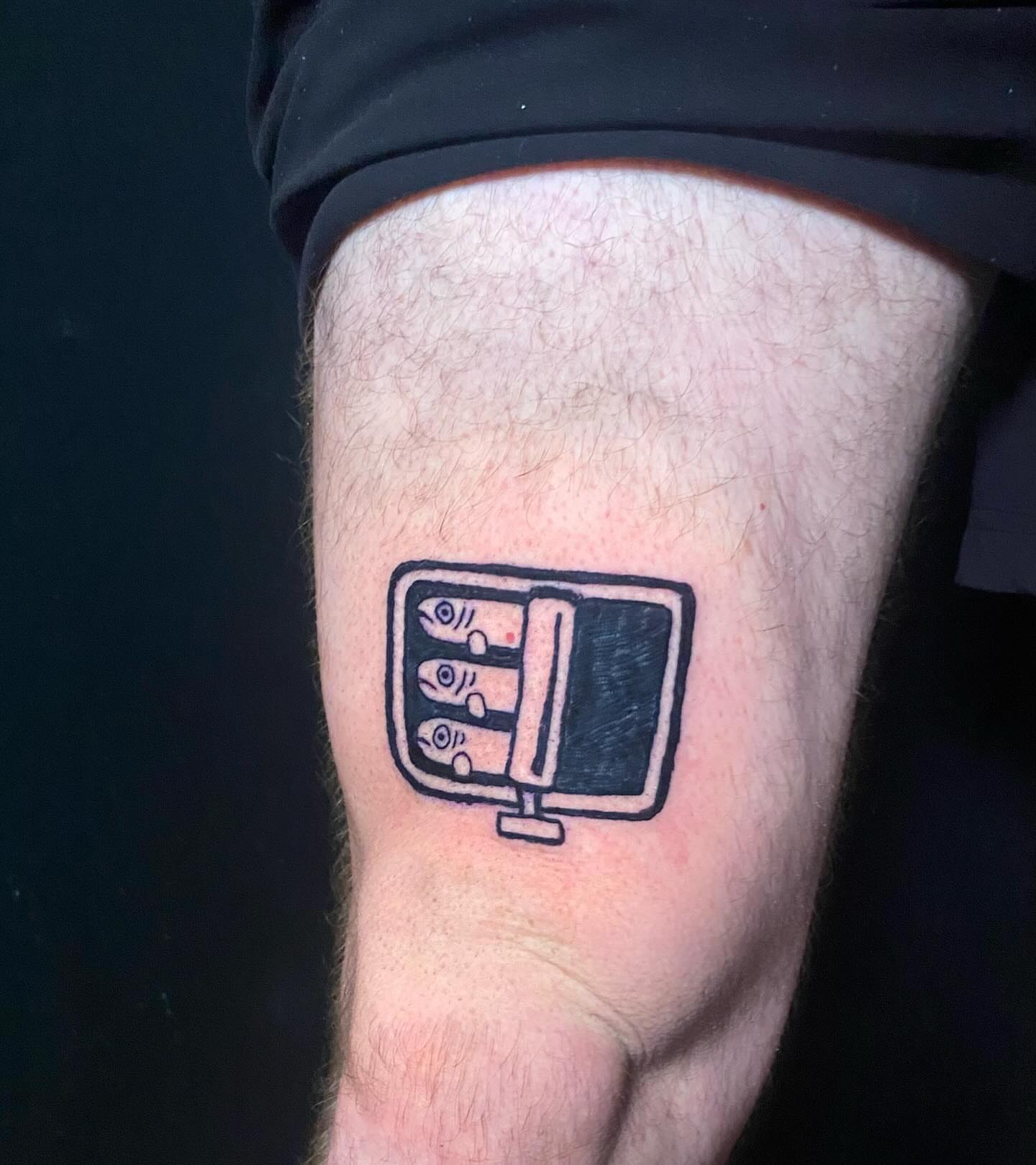 Fish in a container black and grey tattoo on the thigh by ollie, Portland, Oregon