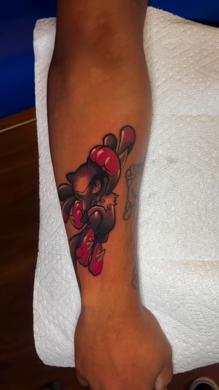 Cartoon character with red cherries new school tattoo on the forearm by Nick Andrade Las Vegas Tattoo Artist