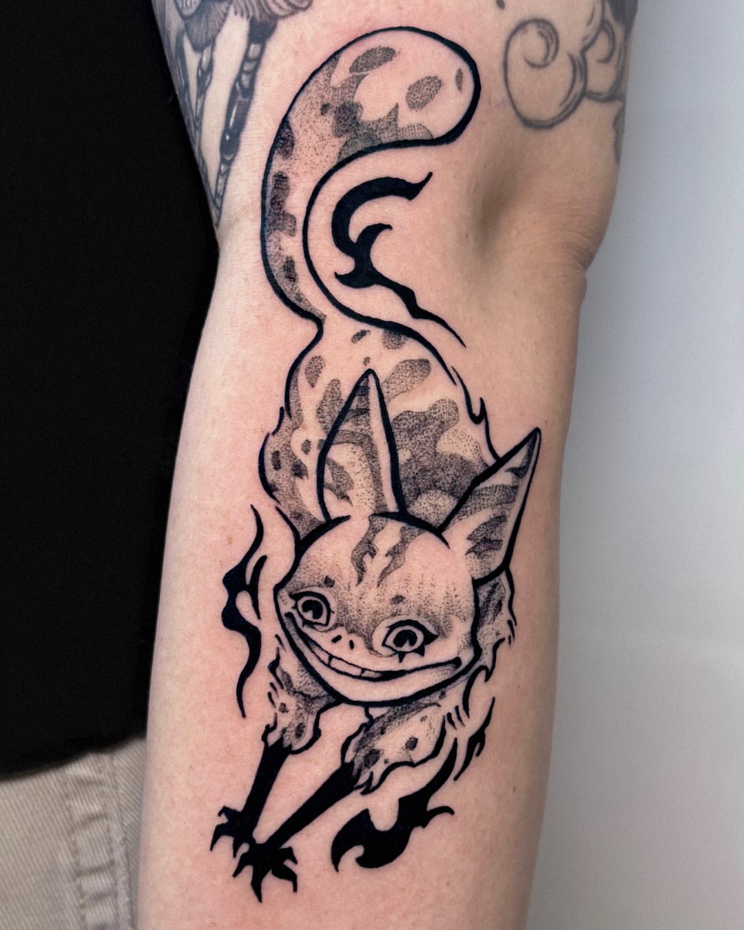 Chibi creature dotwork tattoo on the forearm by Kal