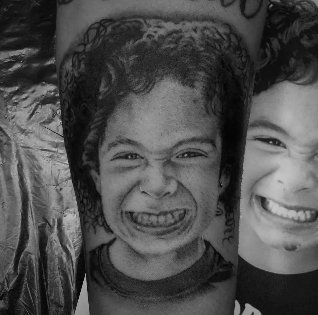 Child portrait realism tattoo on the forearm by Big Steve Lewis