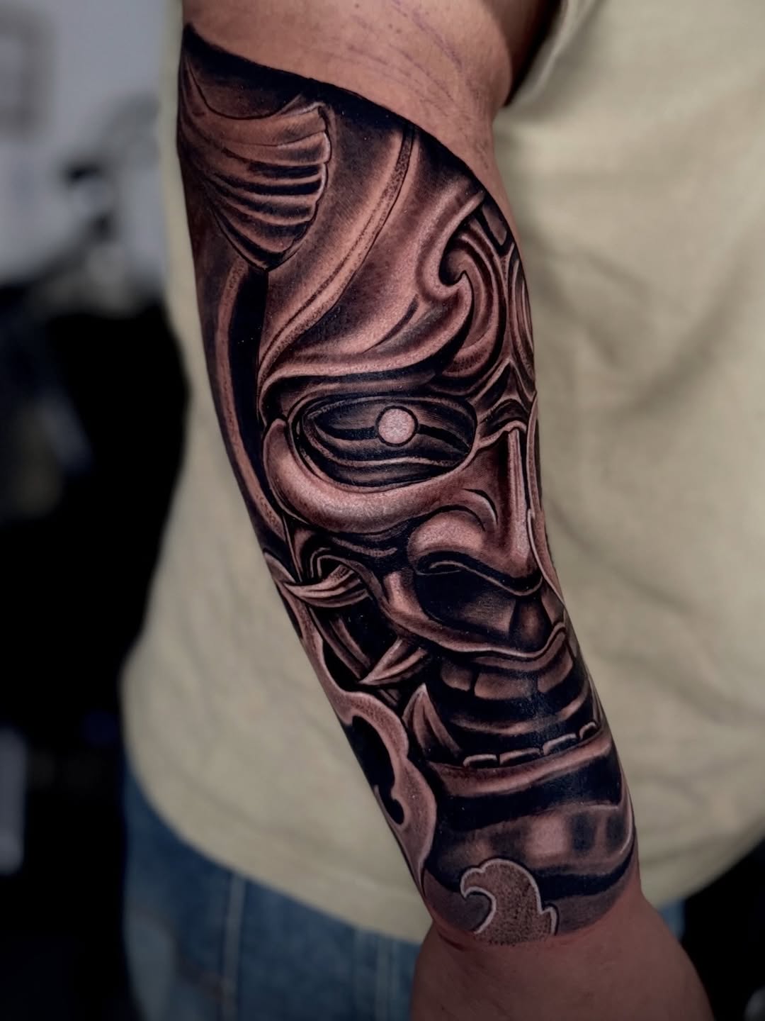 Oni mask Japanese tattoo on the forearm by German Patiño.