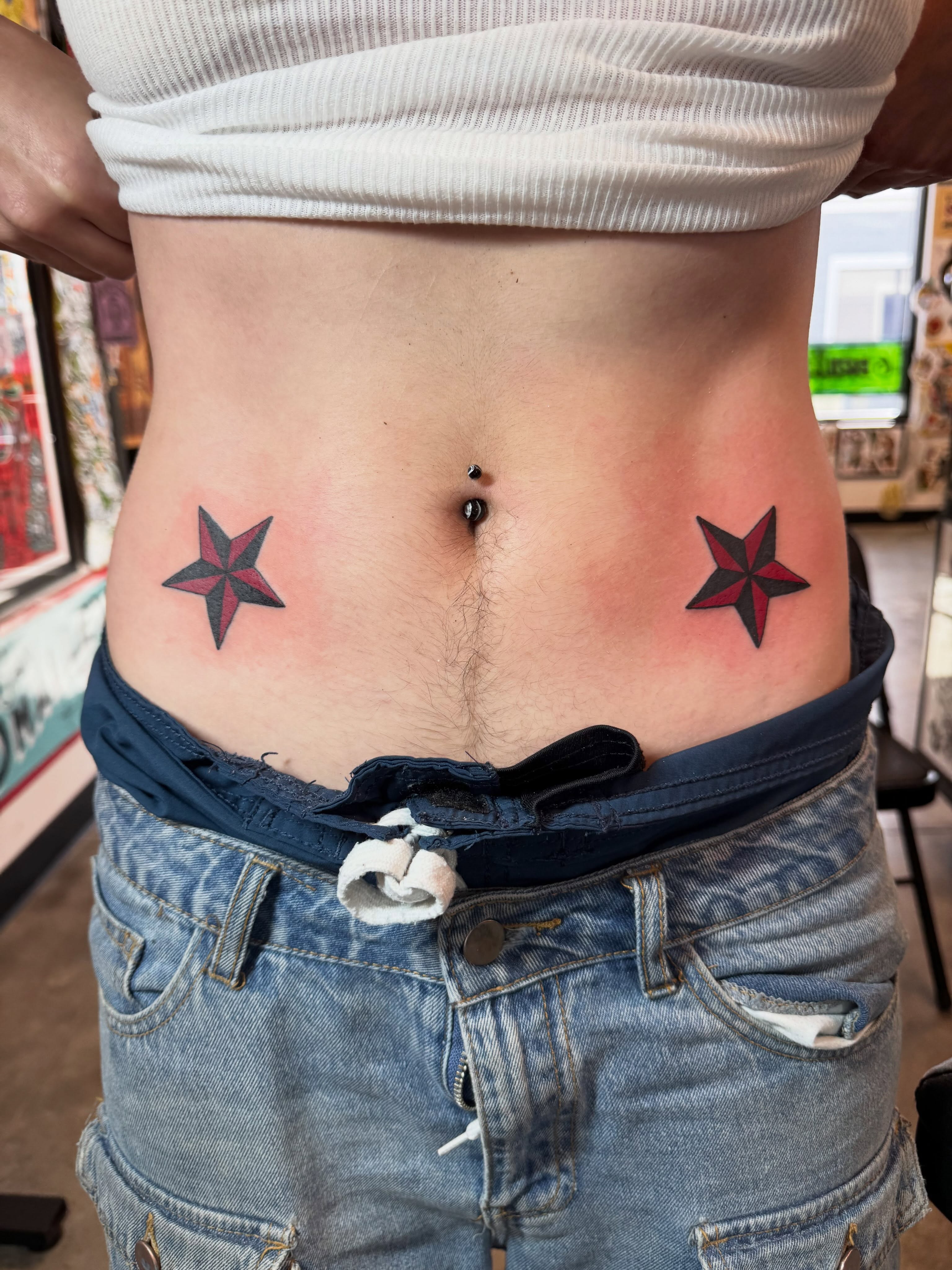 Star geometric tattoo on the torso by j Smalley