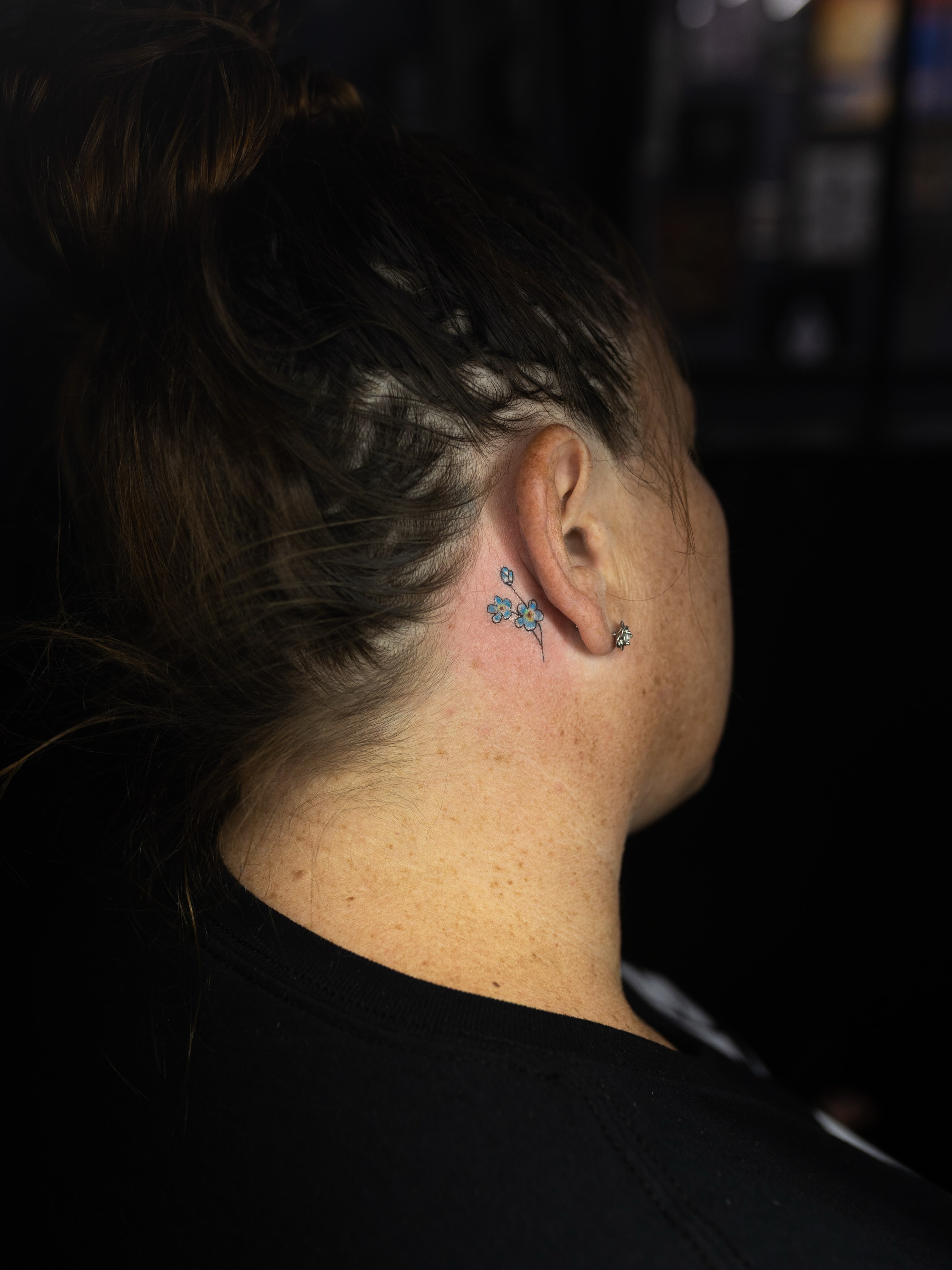Flowers dotwork tattoo on the neck by Kelsie