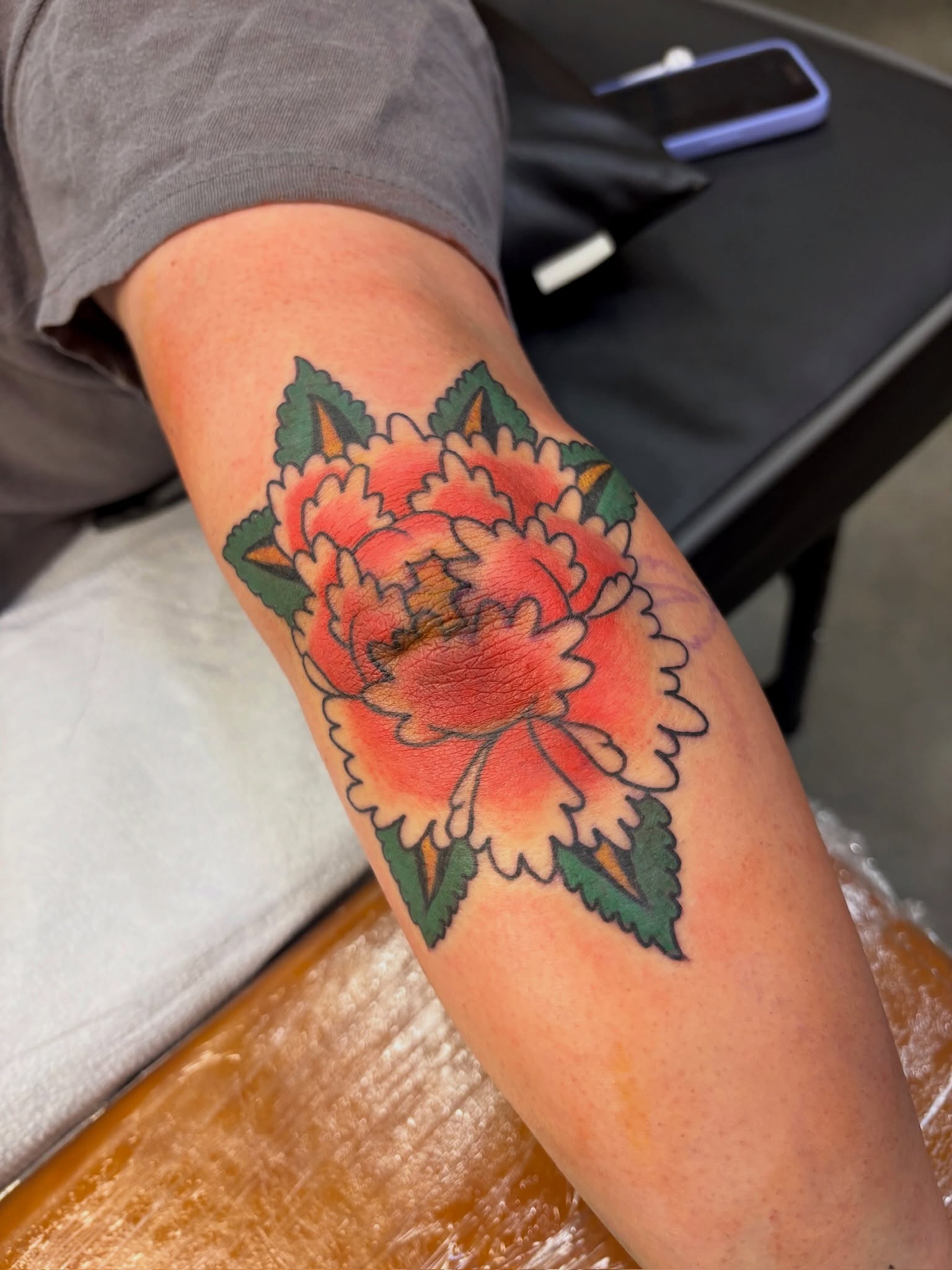 Peony American traditional tattoo on the forearm by Sammy Tattoo, Austin, Texas