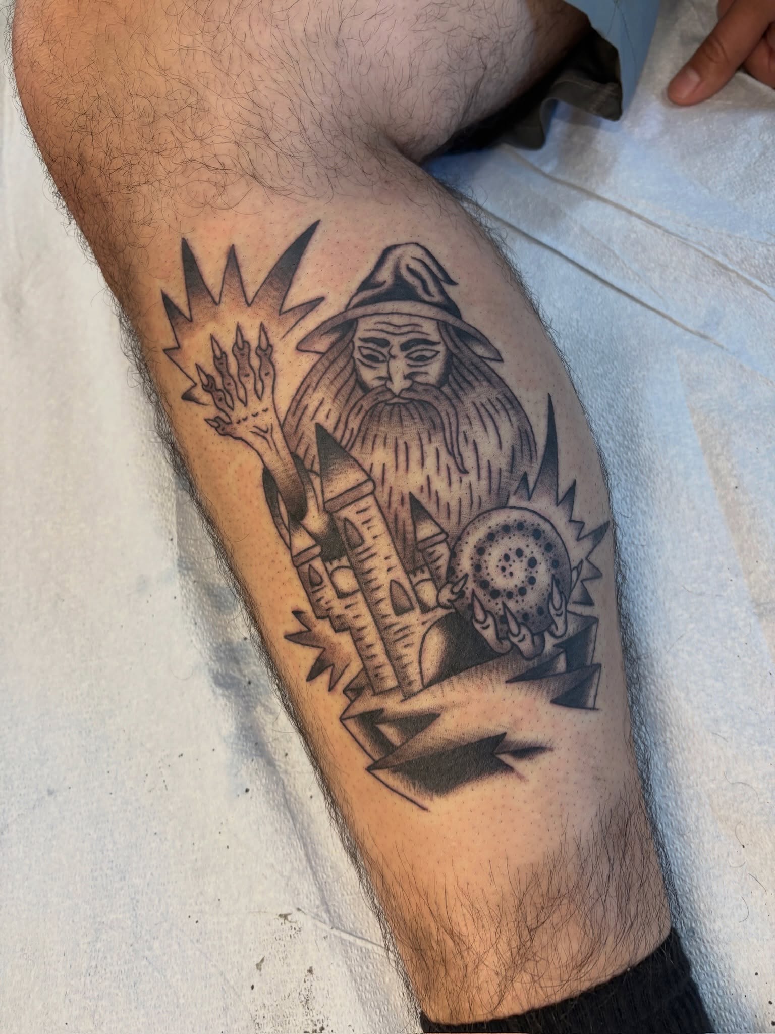 Wizard and magical artifacts realism tattoo on the forearm by Sammy Tattoo, Austin, Texas