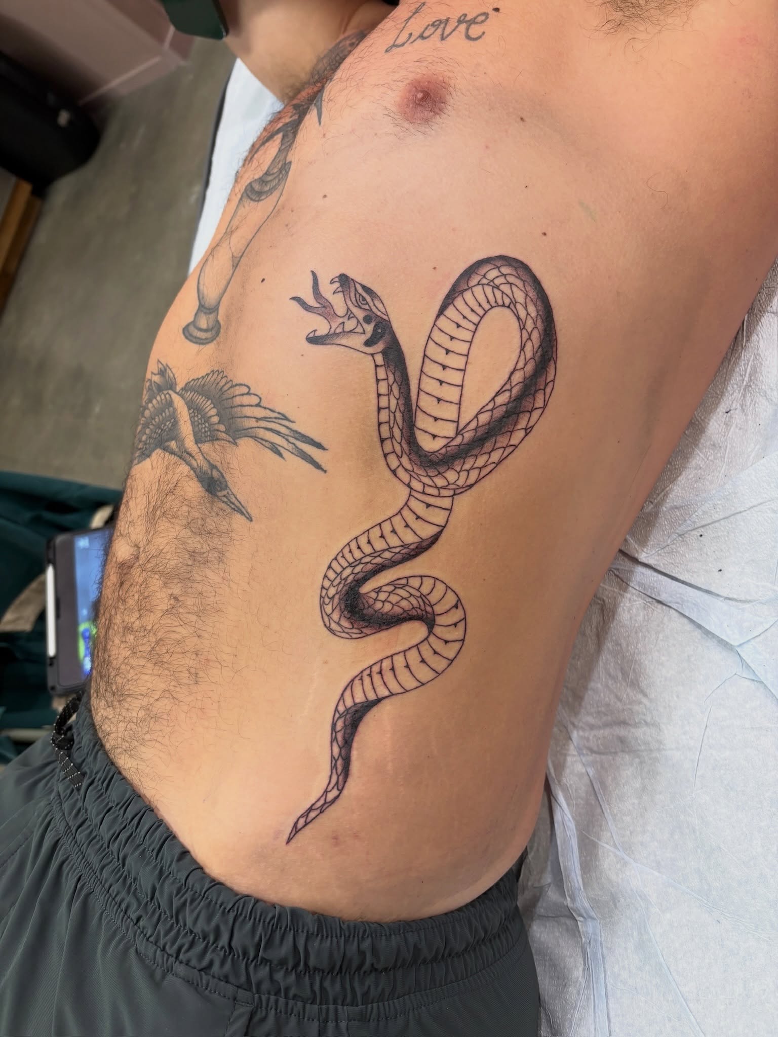 Snake black and grey tattoo by Sammy Tattoo, Austin, Texas