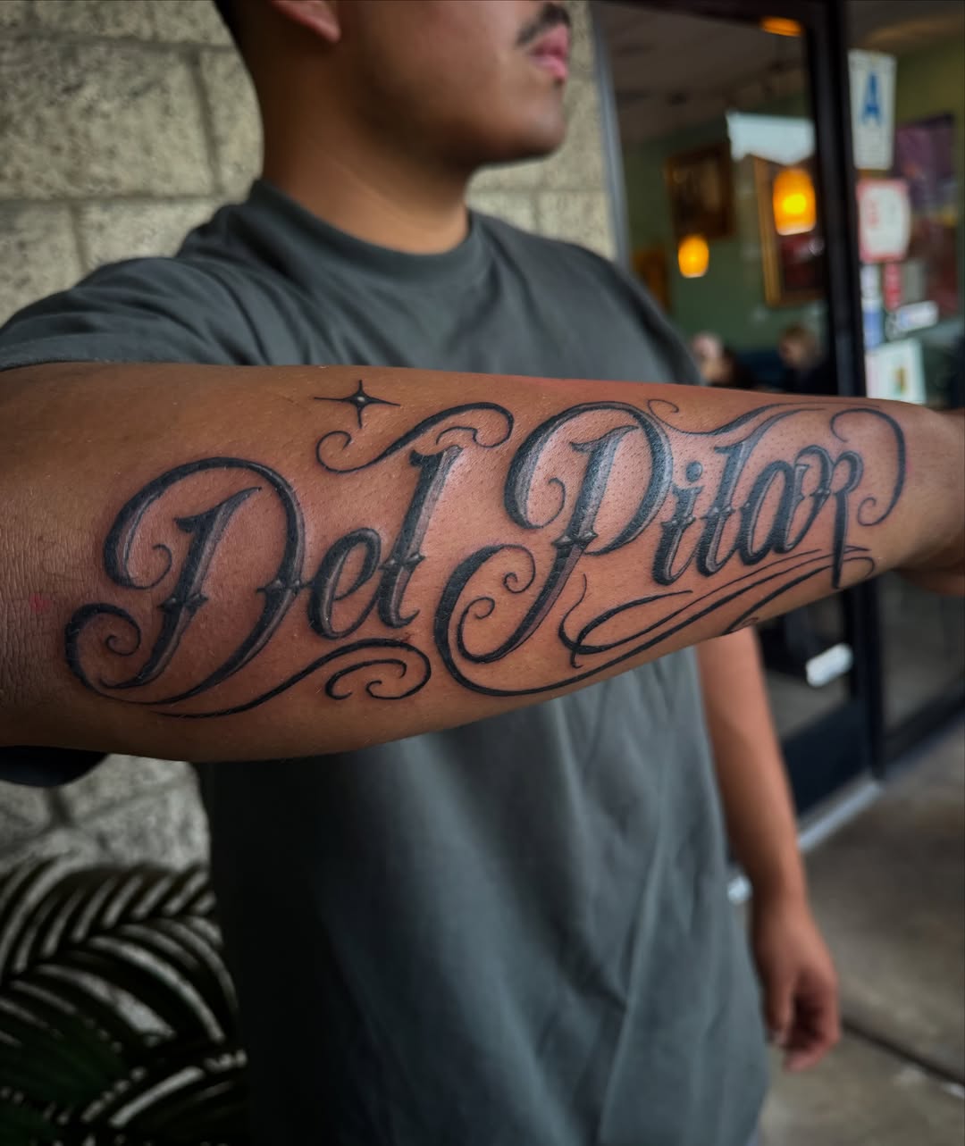 Del Pilar lettering script tattoo on the forearm by LeLe