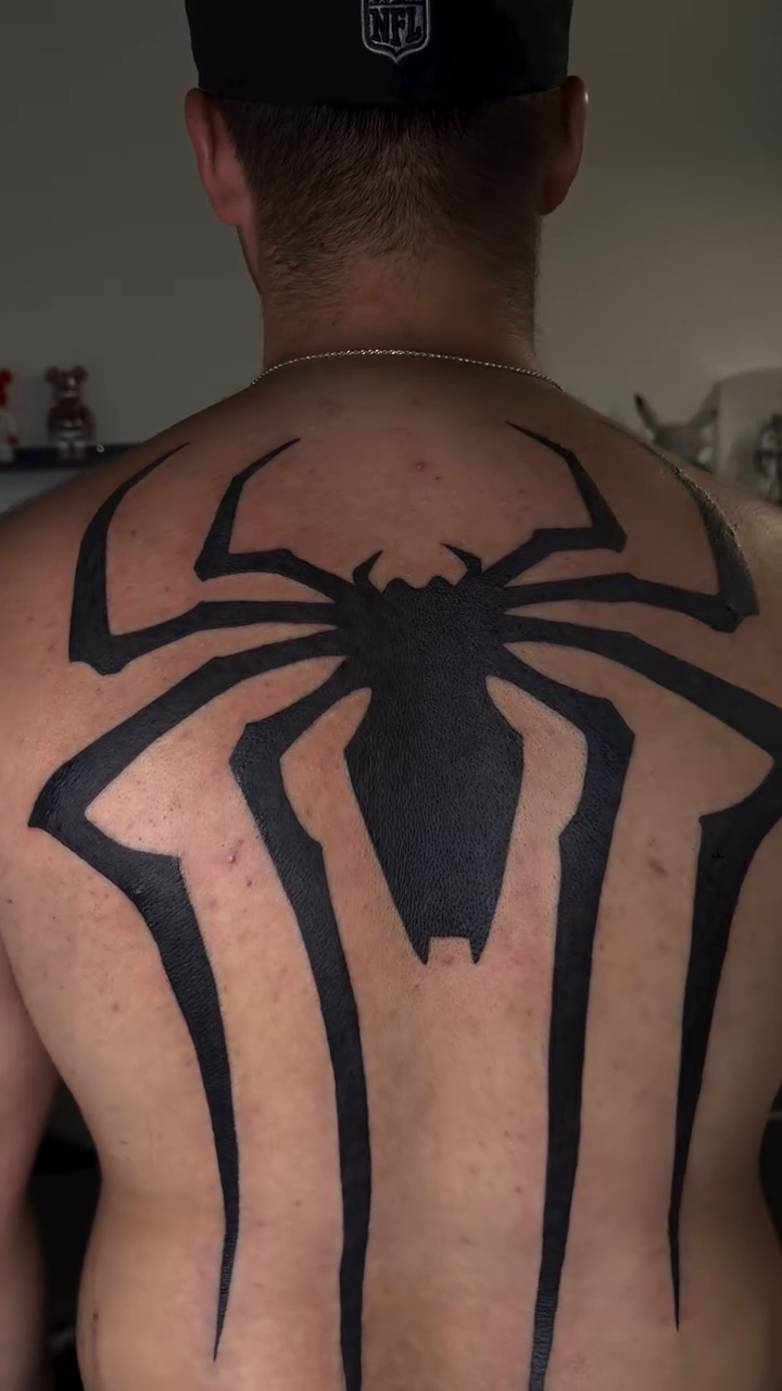 Spider-Man logo cyber sigilism tattoo on the back by Melissa "Lotuss" Chan