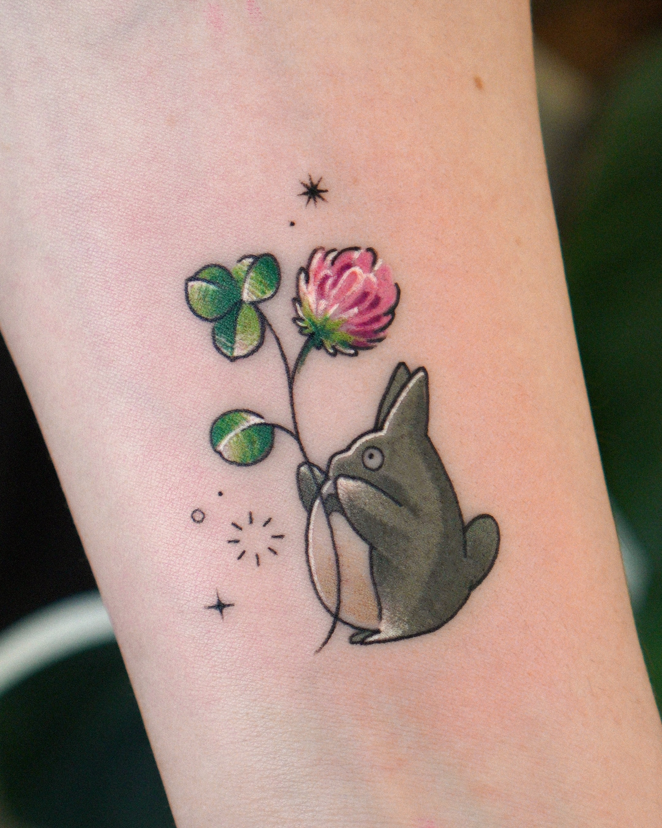 Rabbit and clover dotwork tattoo on the forearm by Eden