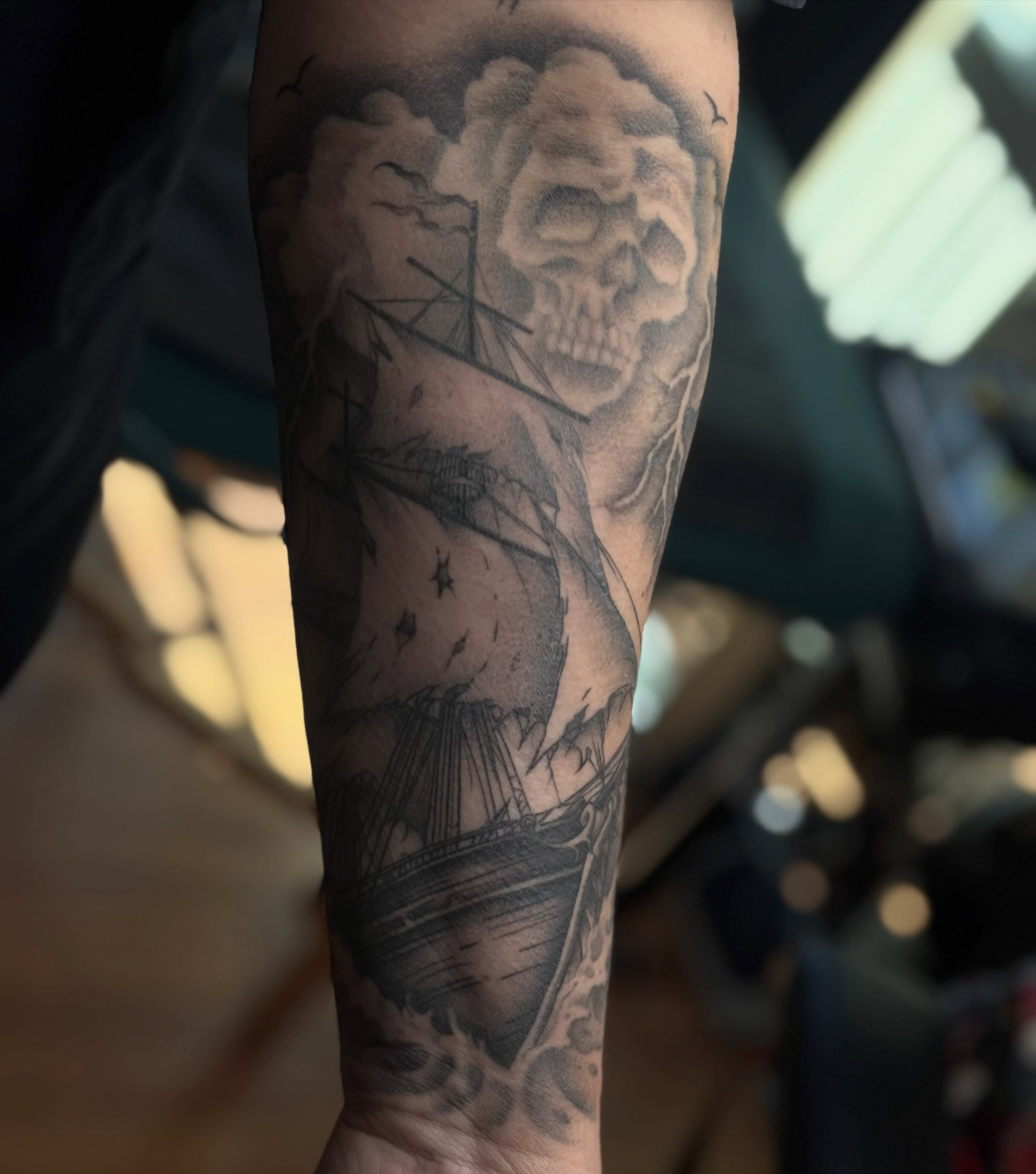 Shipwreck and skull realism tattoo on the forearm by Tattoo, San Diego, California