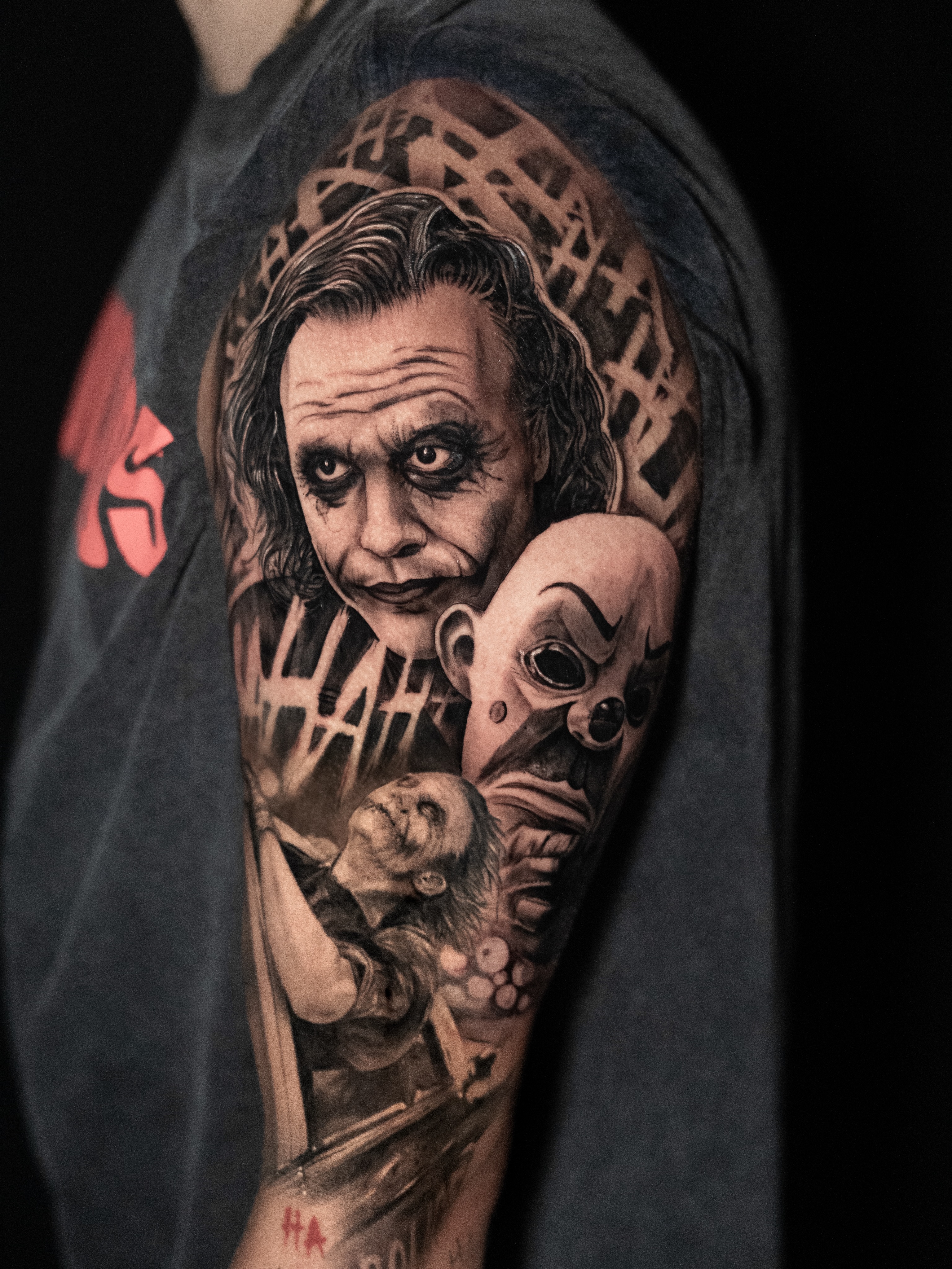 Joker and clown mask realism tattoo on the forearm by James Jurado