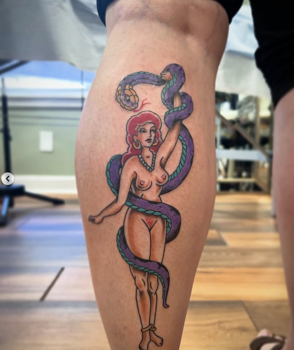Snake and woman American traditional tattoo on the thigh by キノ 🦊