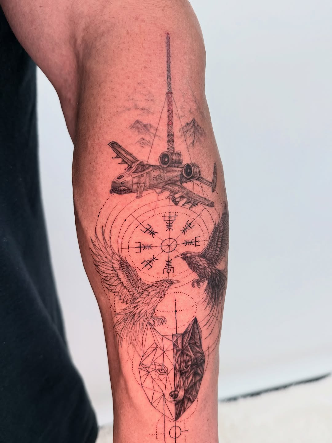 A-10 Warthog, ravens, wolf, and runes realism tattoo on the forearm by Yuri Chloe Ngo Tattoo Artist