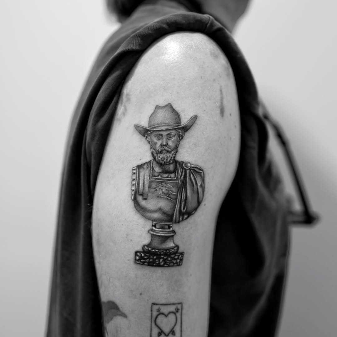 Statue bust black and grey tattoo on the shoulder by Ross Clark Tattoos