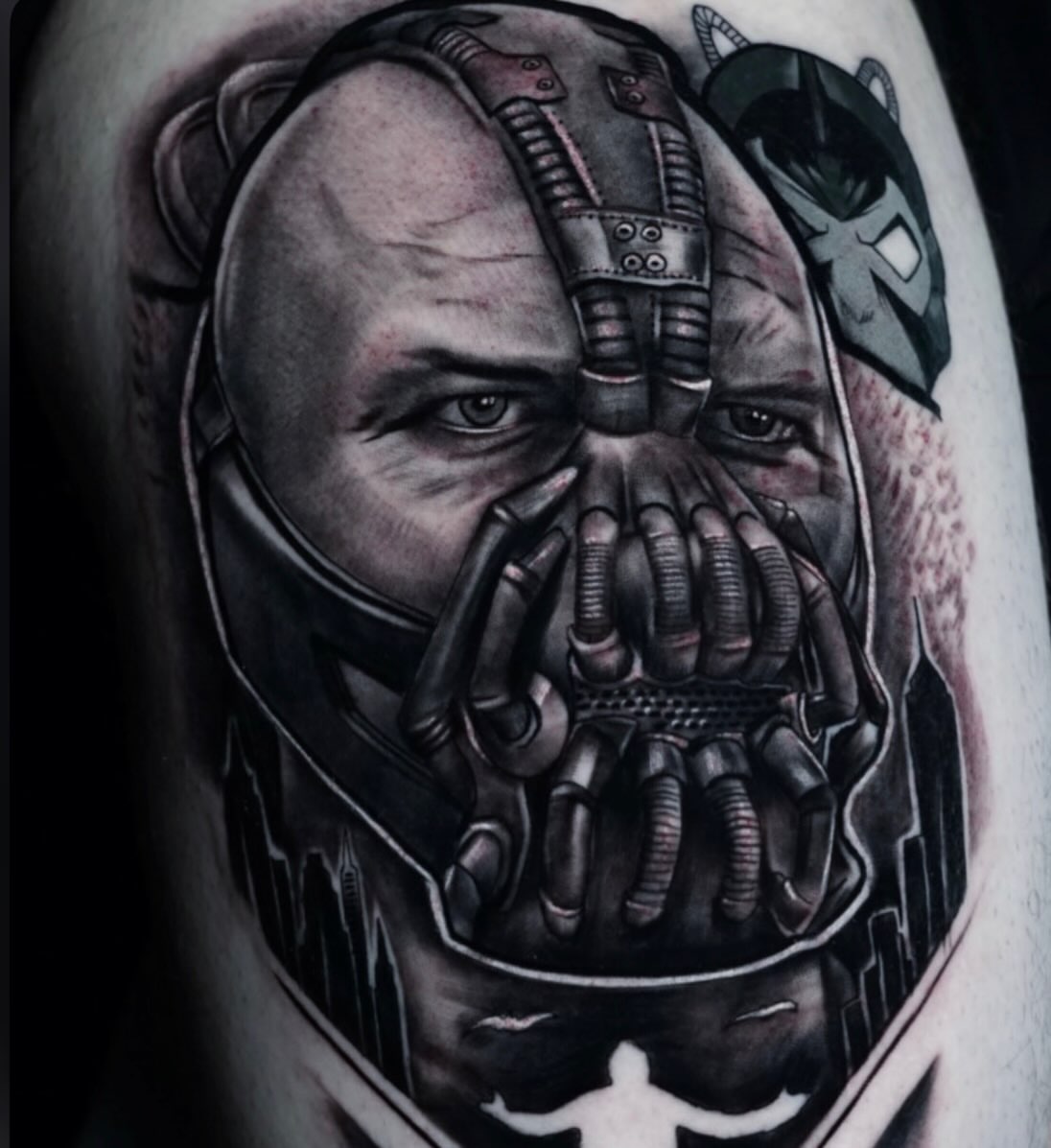 Bane mask dark realism tattoo on the thigh by Jaxx Kesler