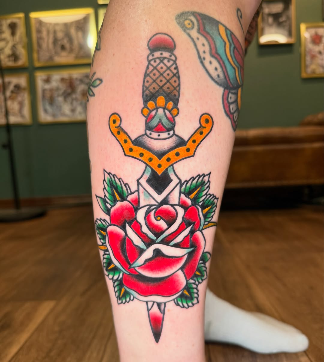 Rose and dagger American traditional tattoo on the calf by Ryan Moraski, Colorado Springs, Colorado