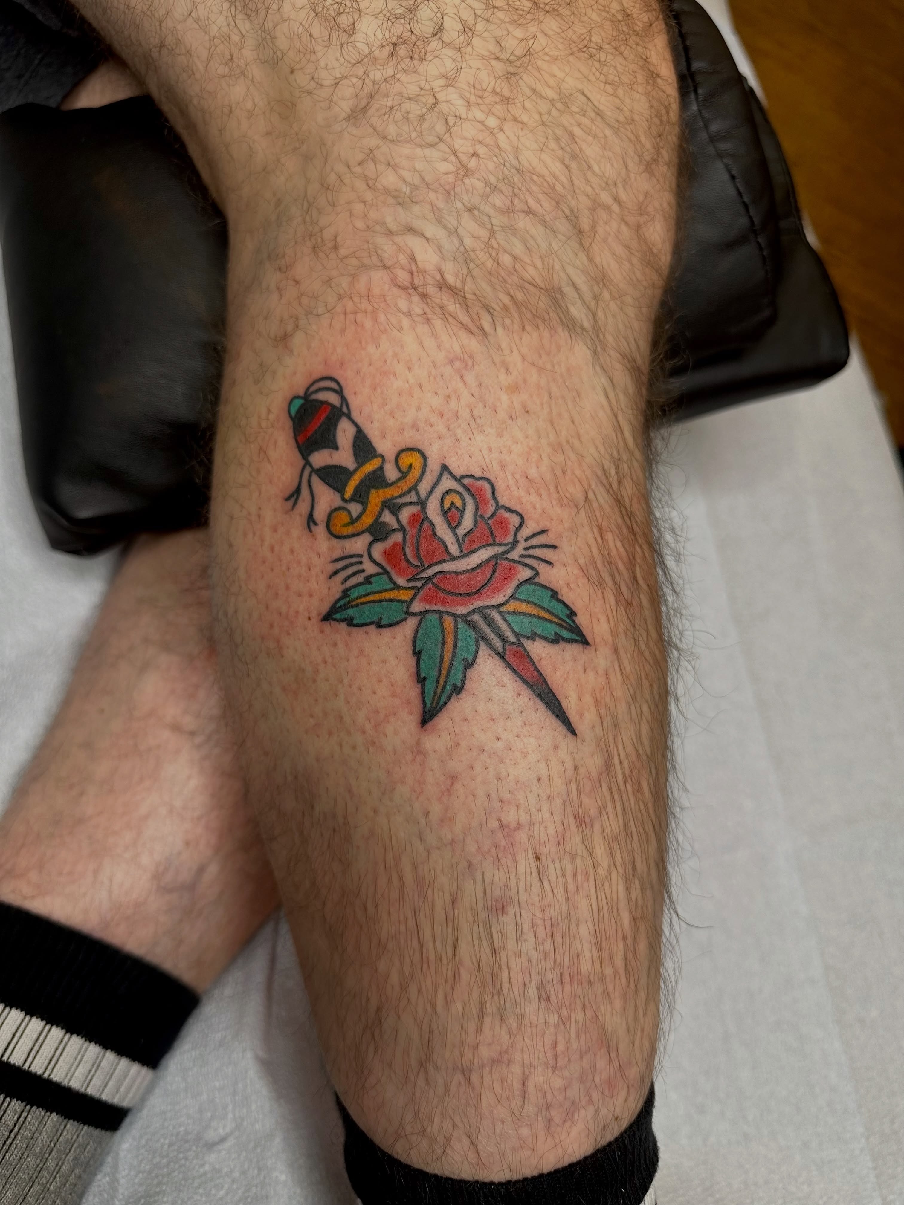 Rose and bee American traditional tattoo on the forearm by teddy, Portland, Oregon