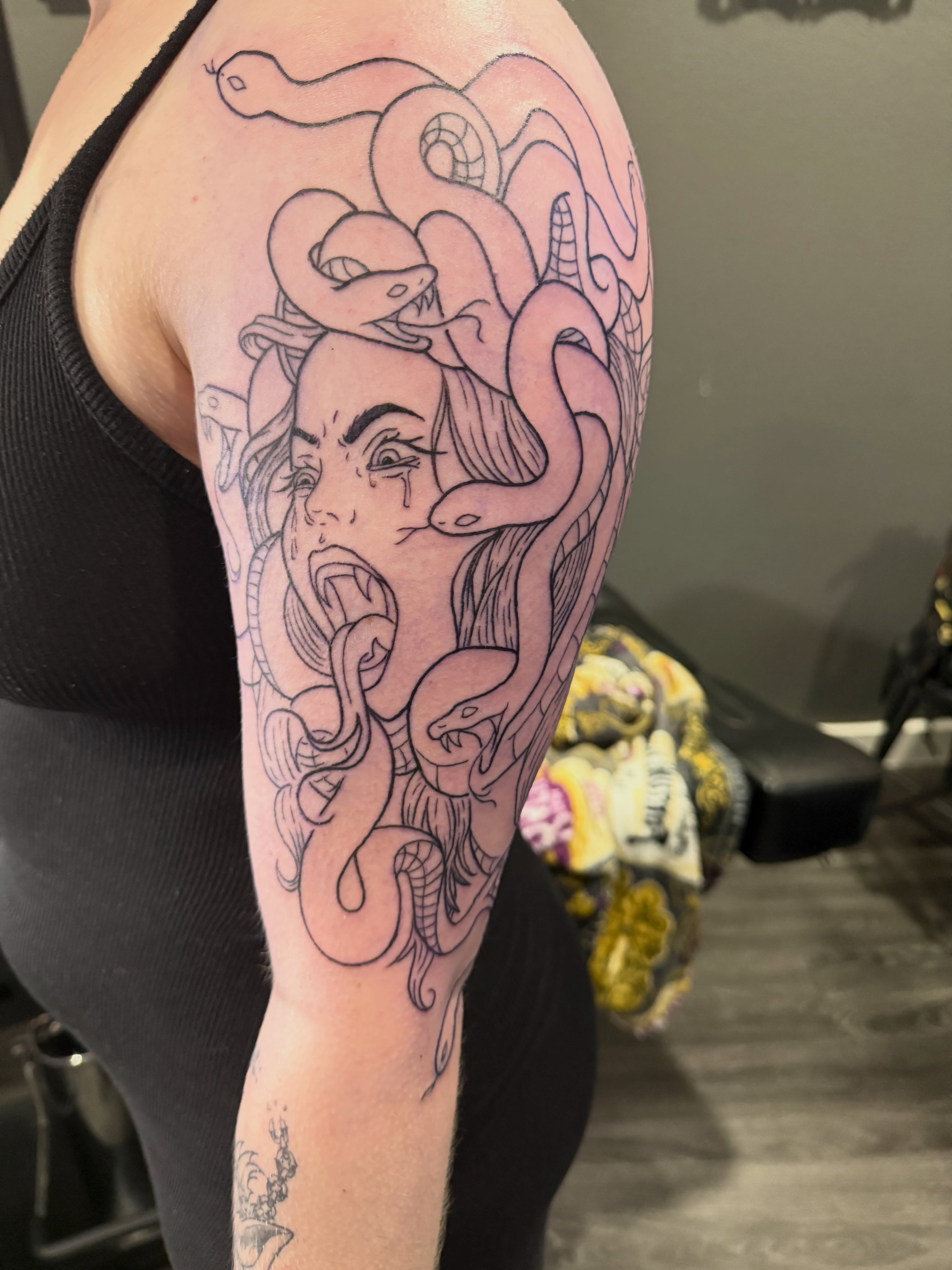 Medusa black and grey tattoo on the forearm by Camryn Justice