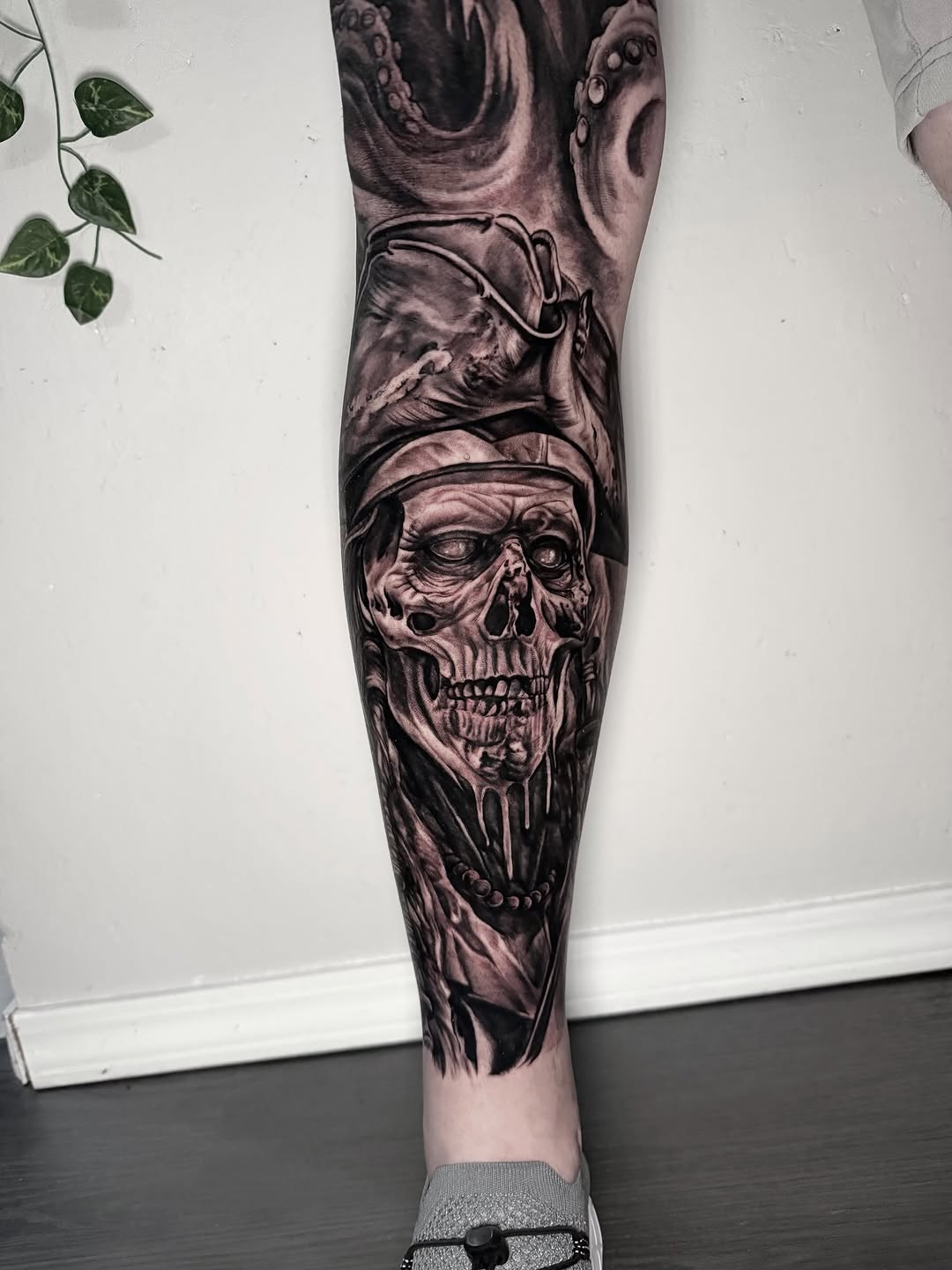 Pirate skull with tentacles realism tattoo on the calf by Elidia Veliz