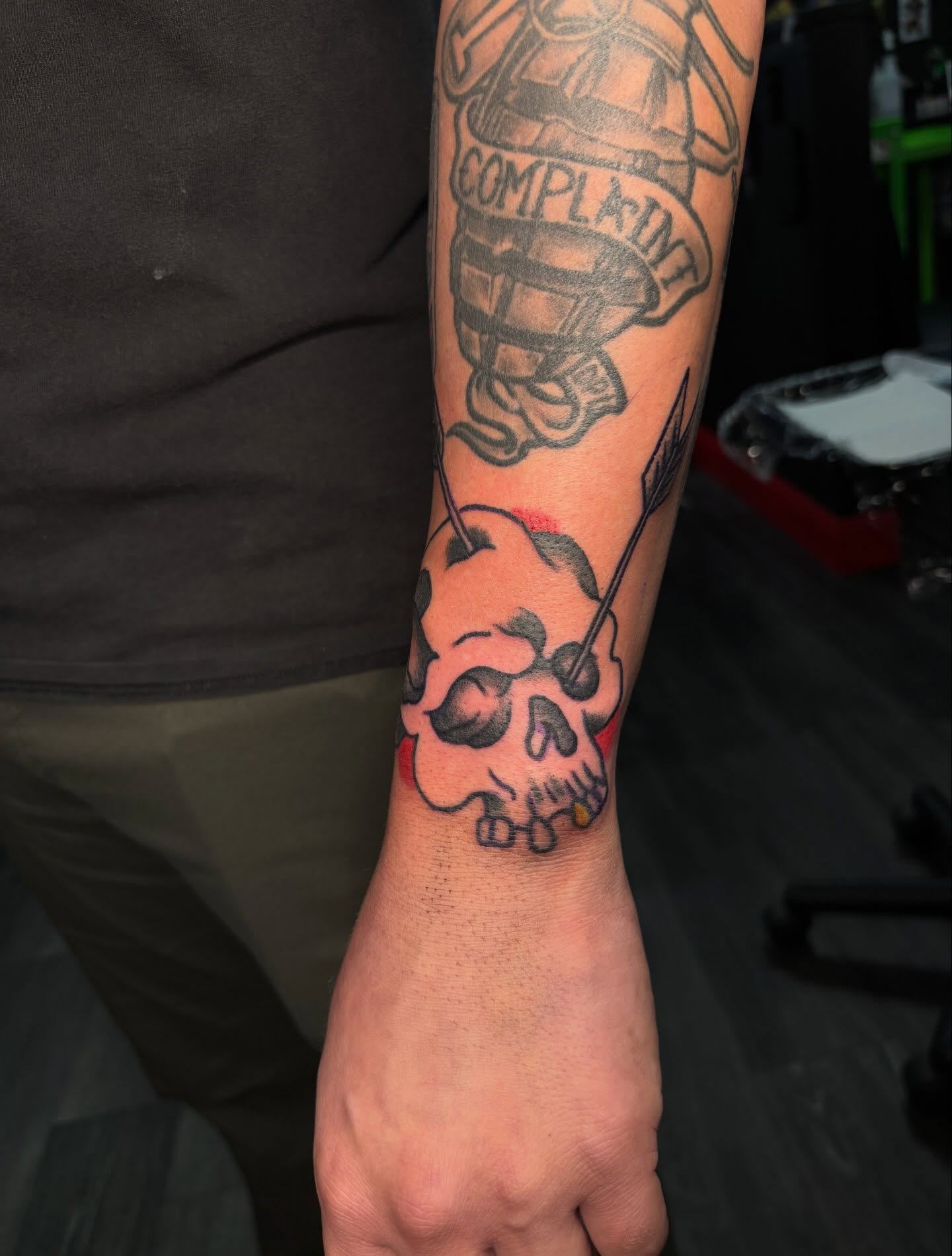 Skull with arrow American traditional tattoo on the forearm by Ethan Ellis, Dallas, Texas