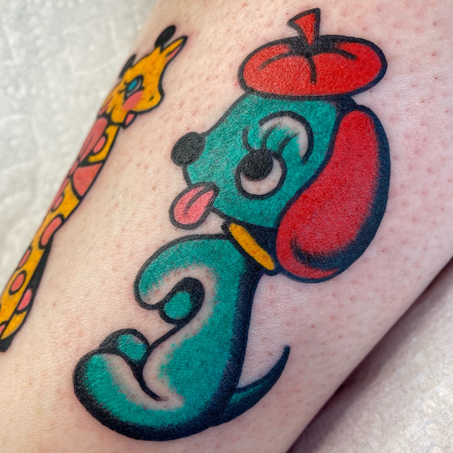 Dog with hat American traditional tattoo on the forearm by ⛓️ L̷i̷n̷n̷e̷a̷⛓️, Las Vegas, Nevada