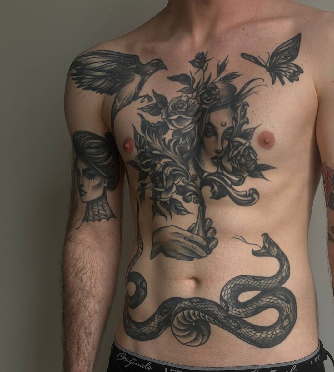 Floral and mythological realism tattoo on the chest by Elvira Savchuk