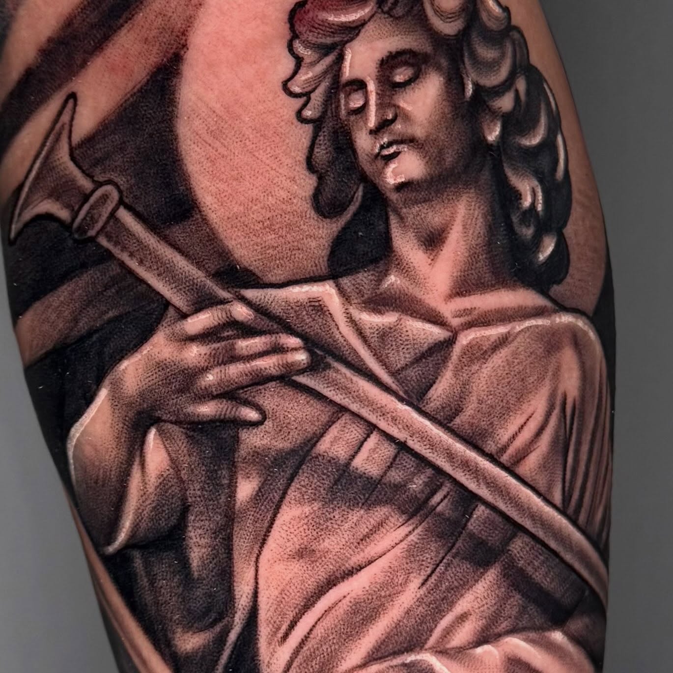 Statue of jesus realism tattoo on the forearm by Pablo Venegas