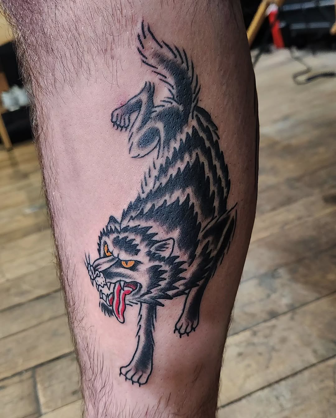 Wolf realism tattoo on the leg by Douglas Grady