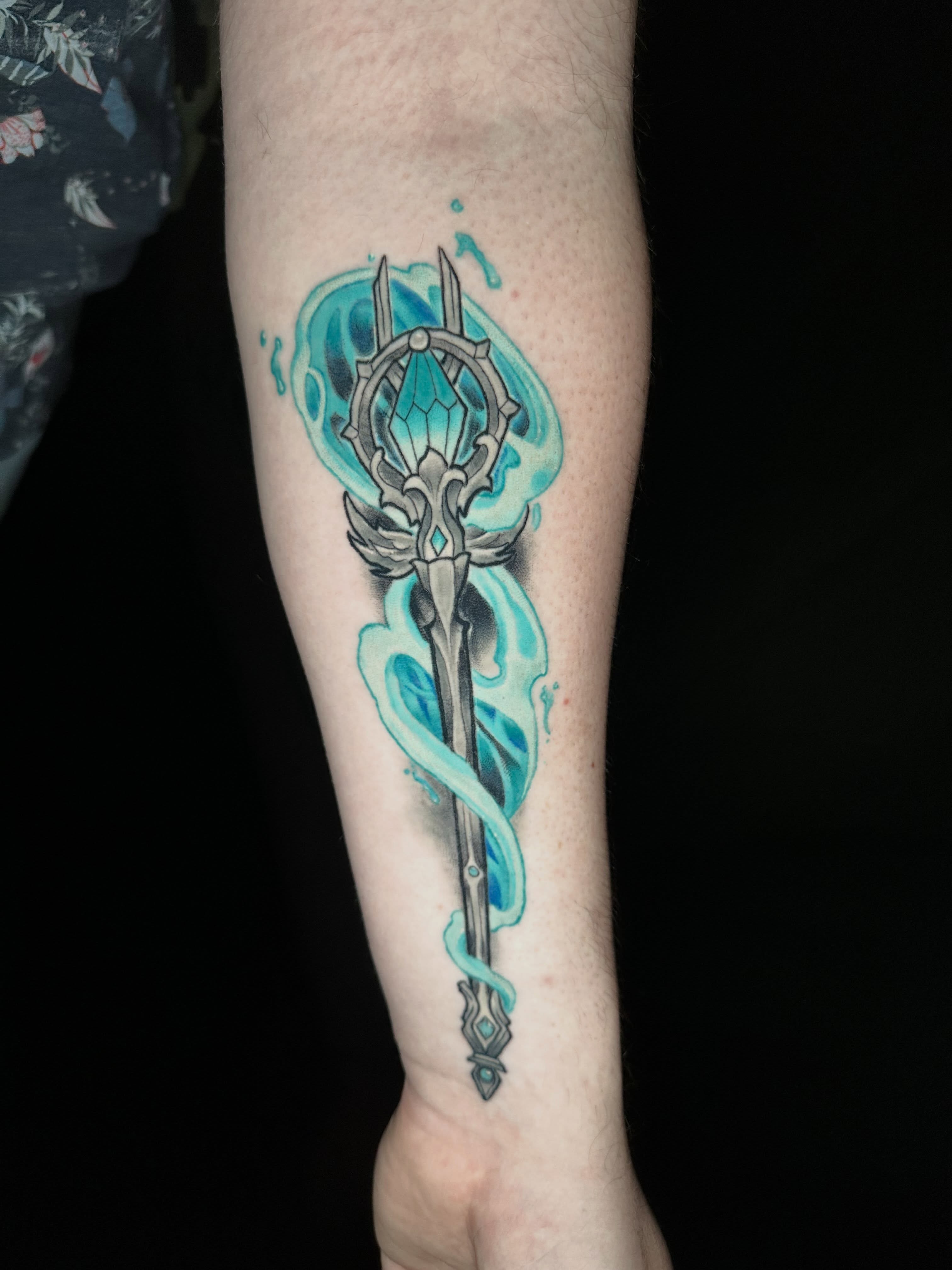 Trident and water geometric tattoo on the forearm by John Milosh Chamberlin