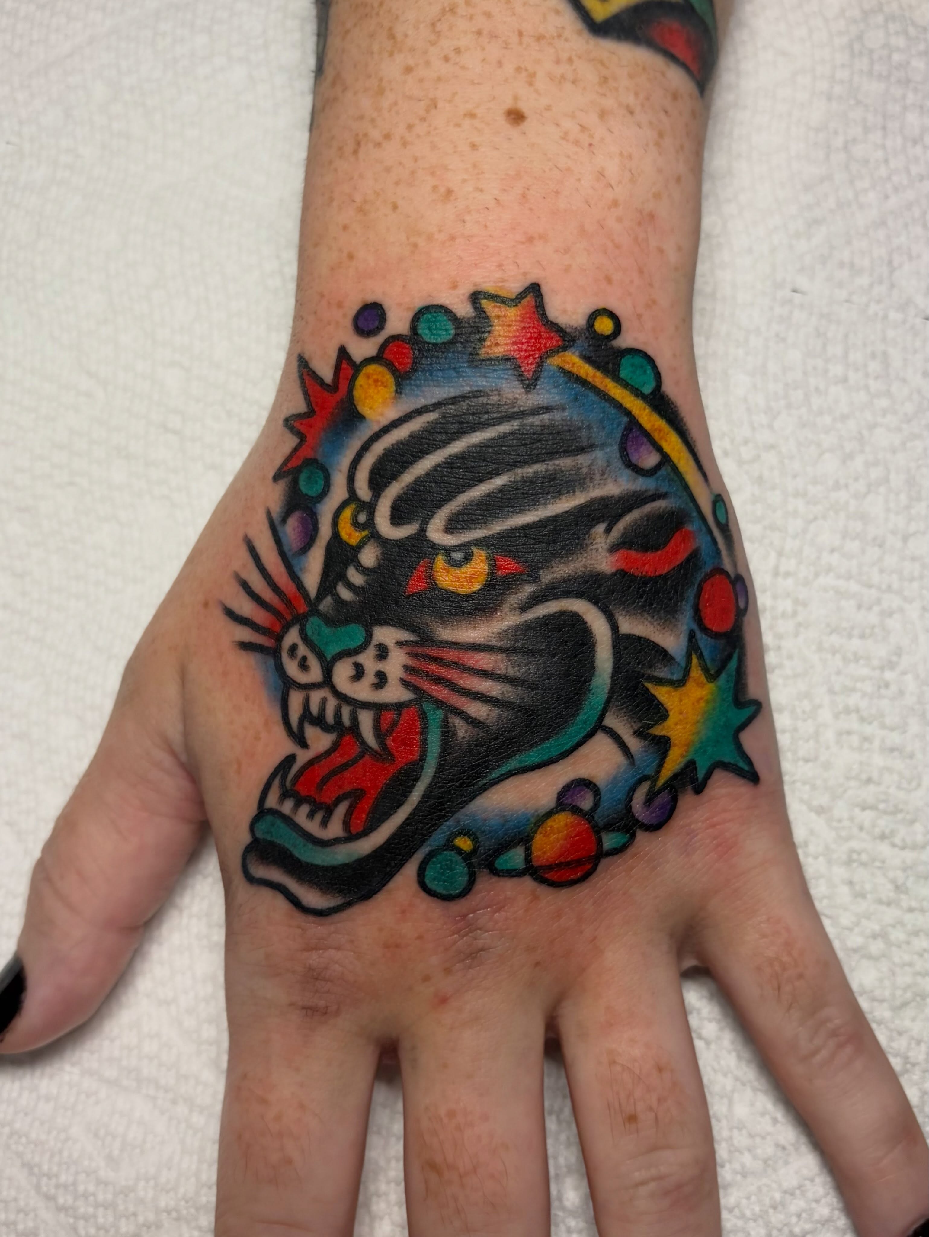 Panther American traditional tattoo on the hand by David Armacost, Cincinnati, Ohio