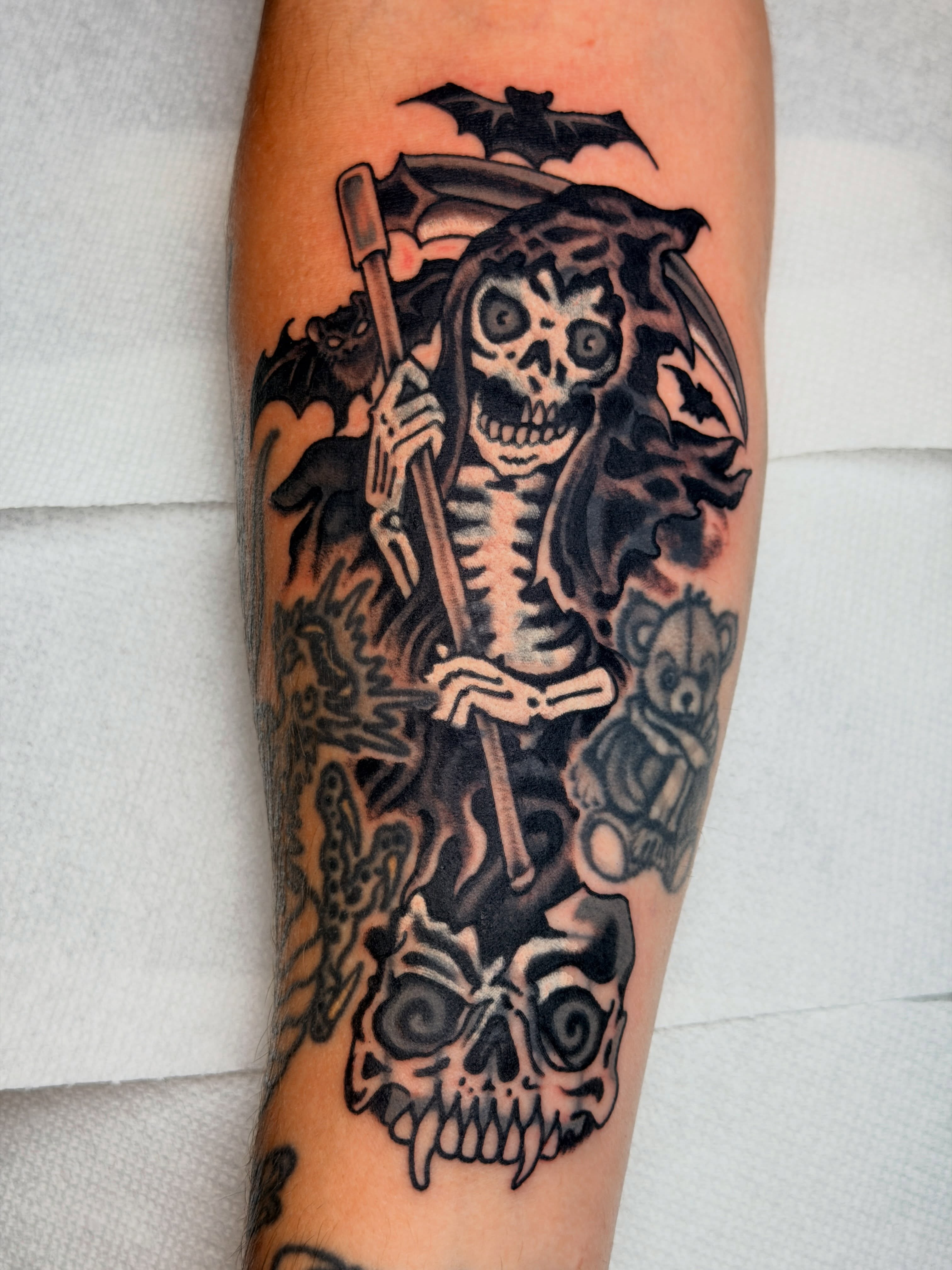 Skeleton with scythe American traditional tattoo on the forearm by ๐๐ซ๐ข๐ ๐๐ฅ๐ญ๐จ๐ง๐๐ง