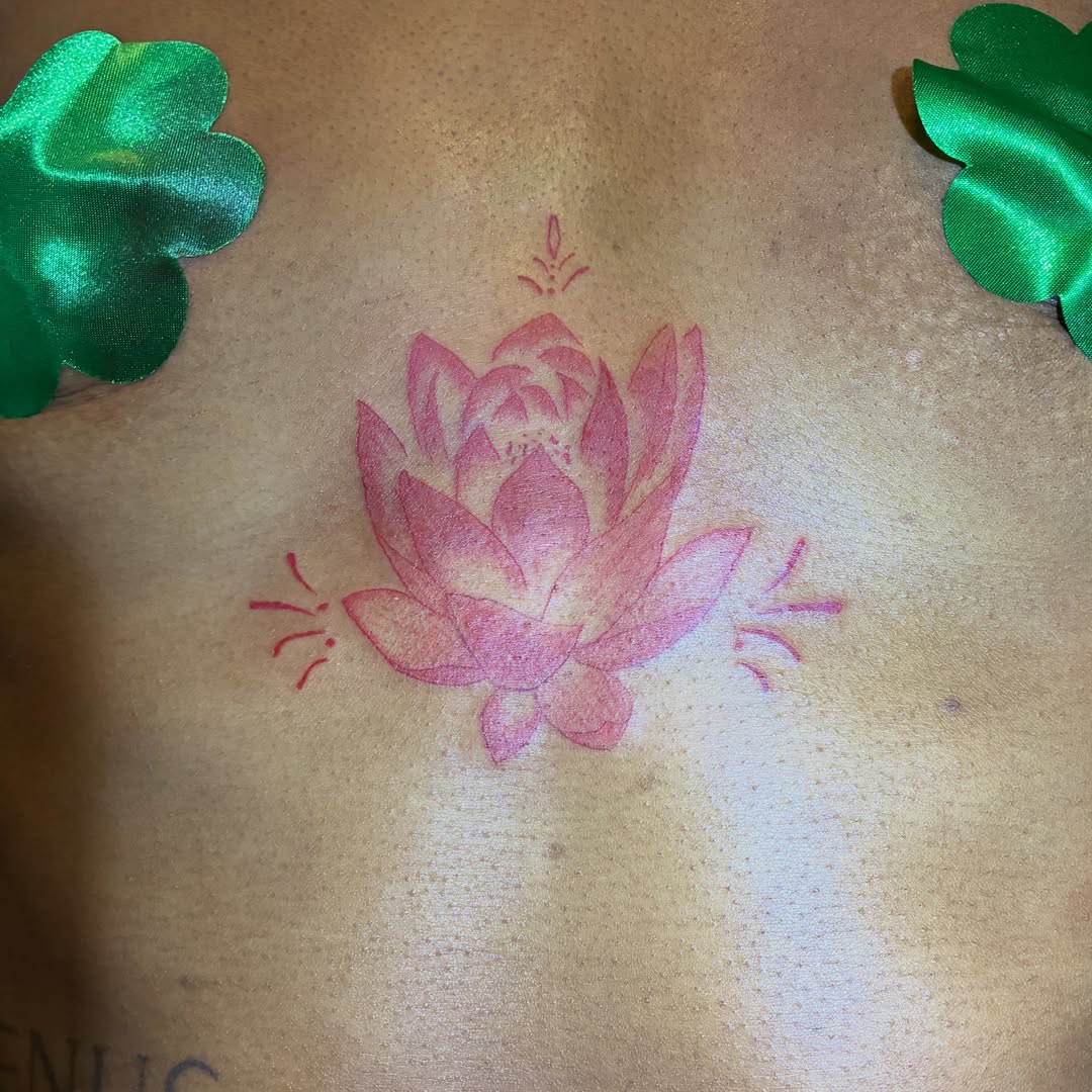 Lotus flower watercolor tattoo on the back by Seattle Tattoo Artist