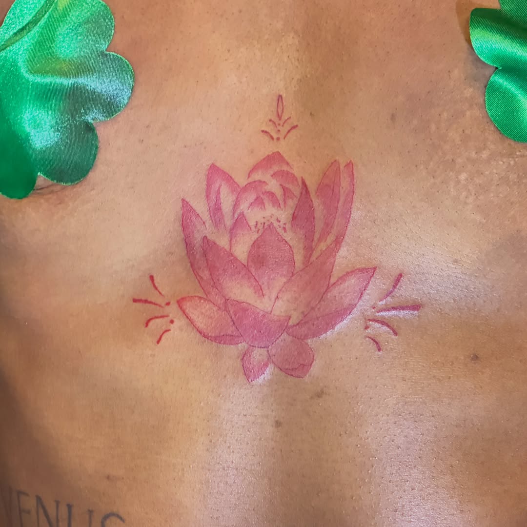 Lotus flower dotwork tattoo on the chest by Seattle Tattoo Artist