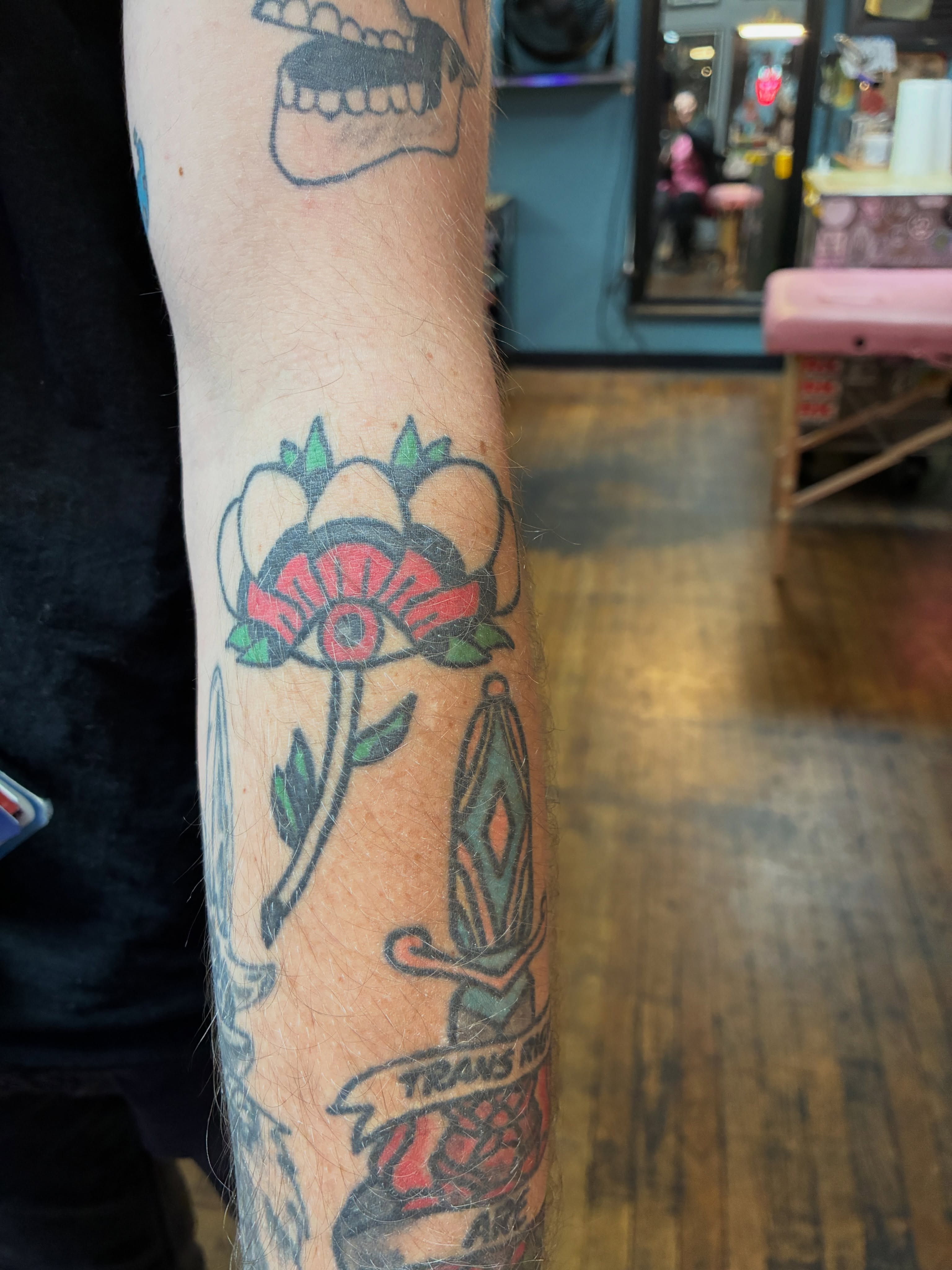 Flower and dagger American traditional tattoo on the forearm by Seattle Tattoo Artist