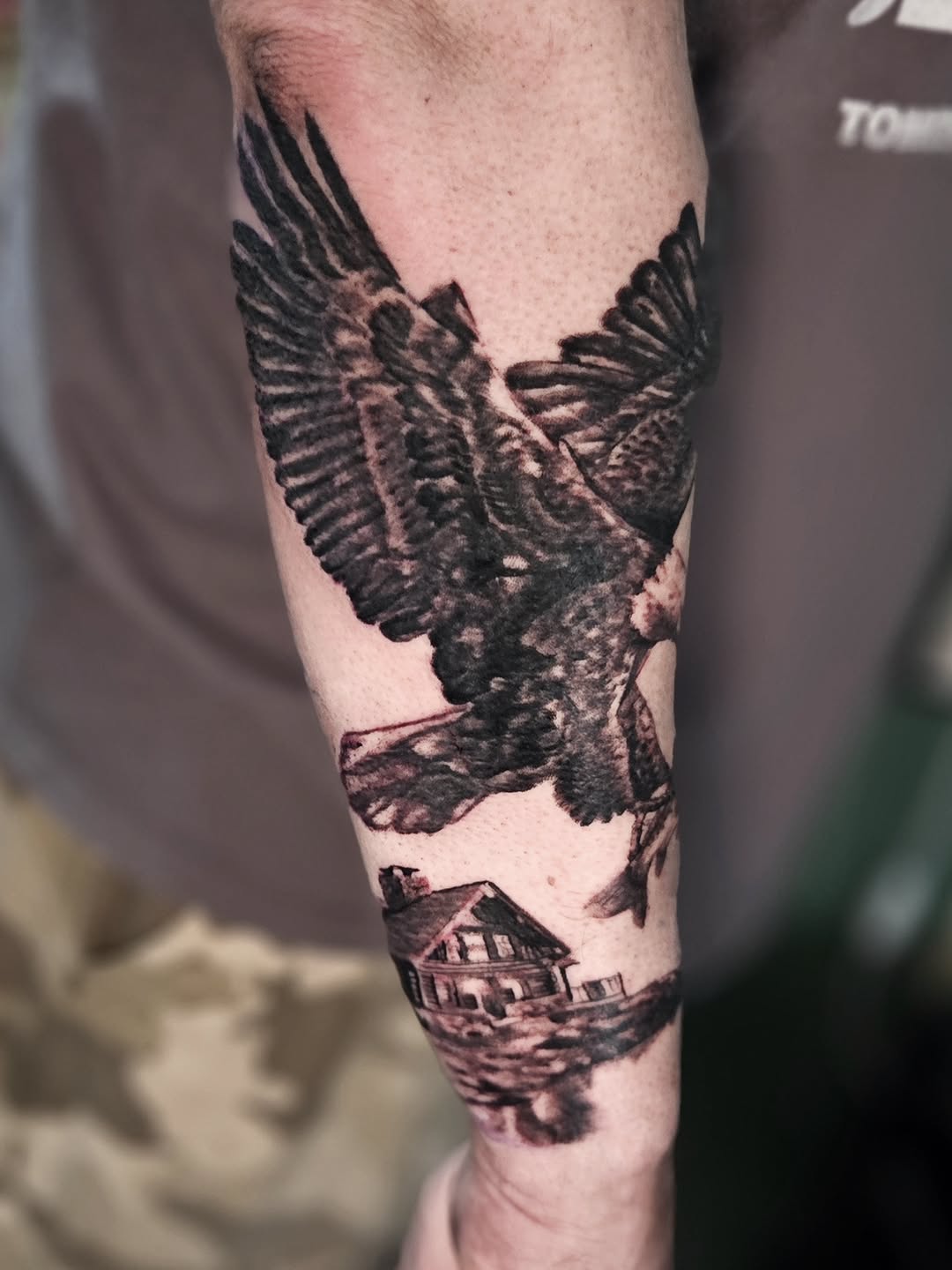 Eagle and house tattoo on the forearm by Walt