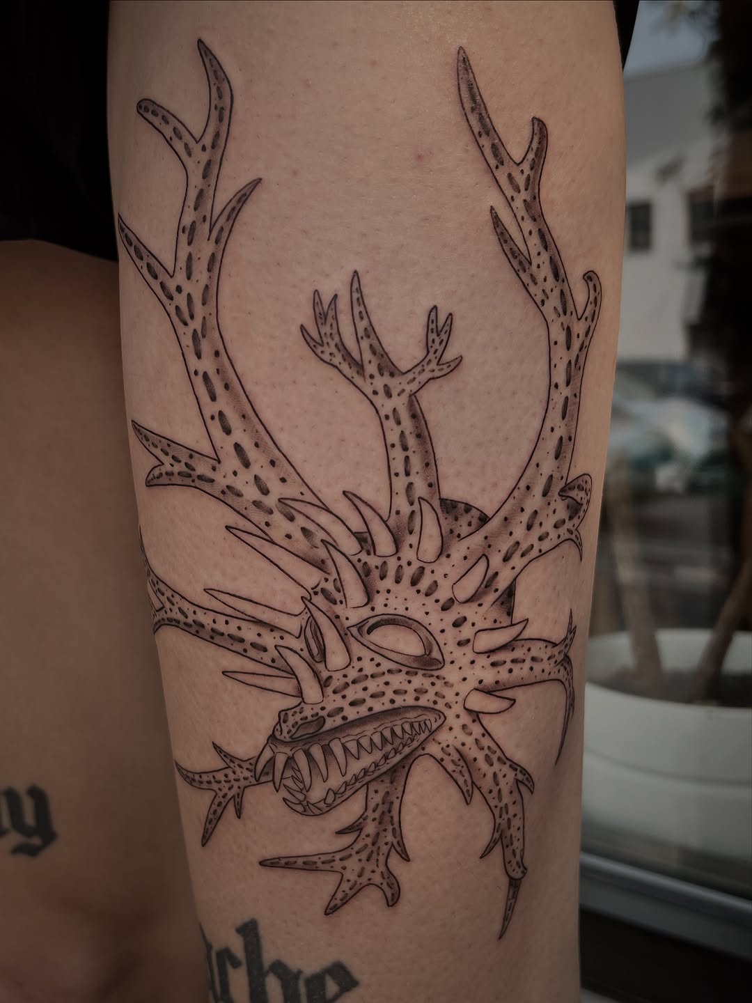 Tattoo by @southpaw.stipple — black_and_grey, dotwork