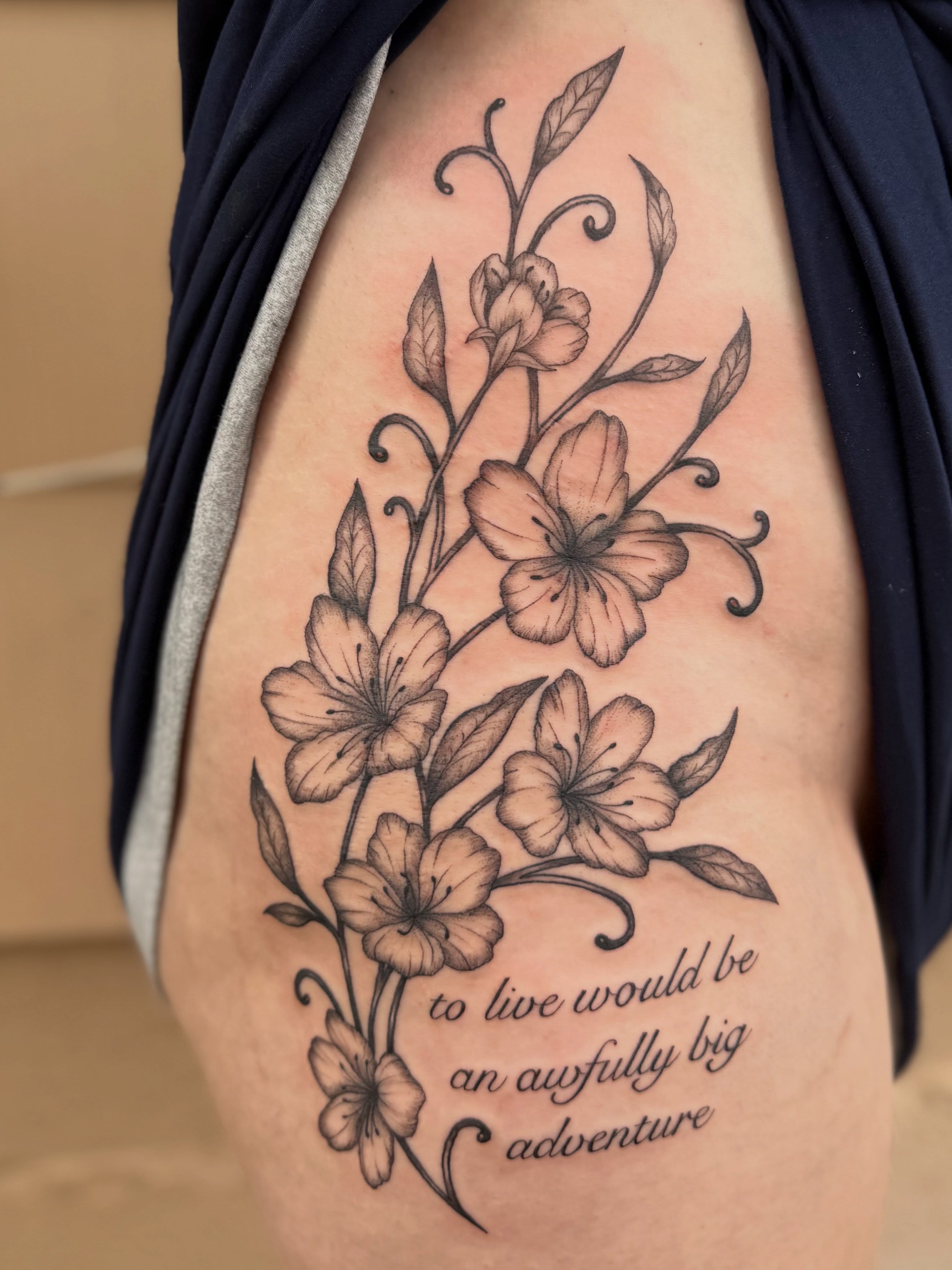 Flowers and quote black and grey tattoo on the ribs by Jocelyne ♡