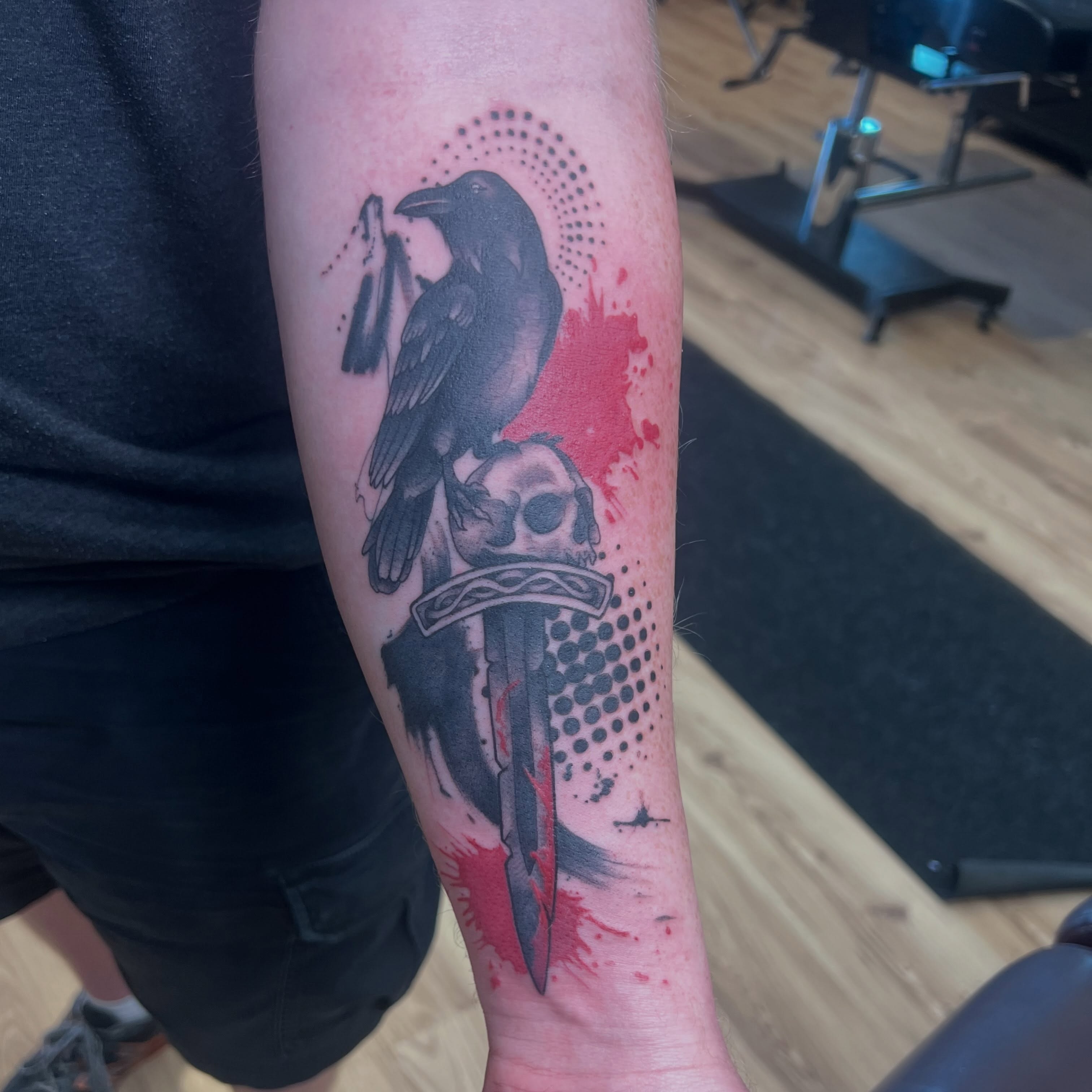 Raven and skull dotwork tattoo on the forearm by Bailey Goodwin, Ankeny, Iowa