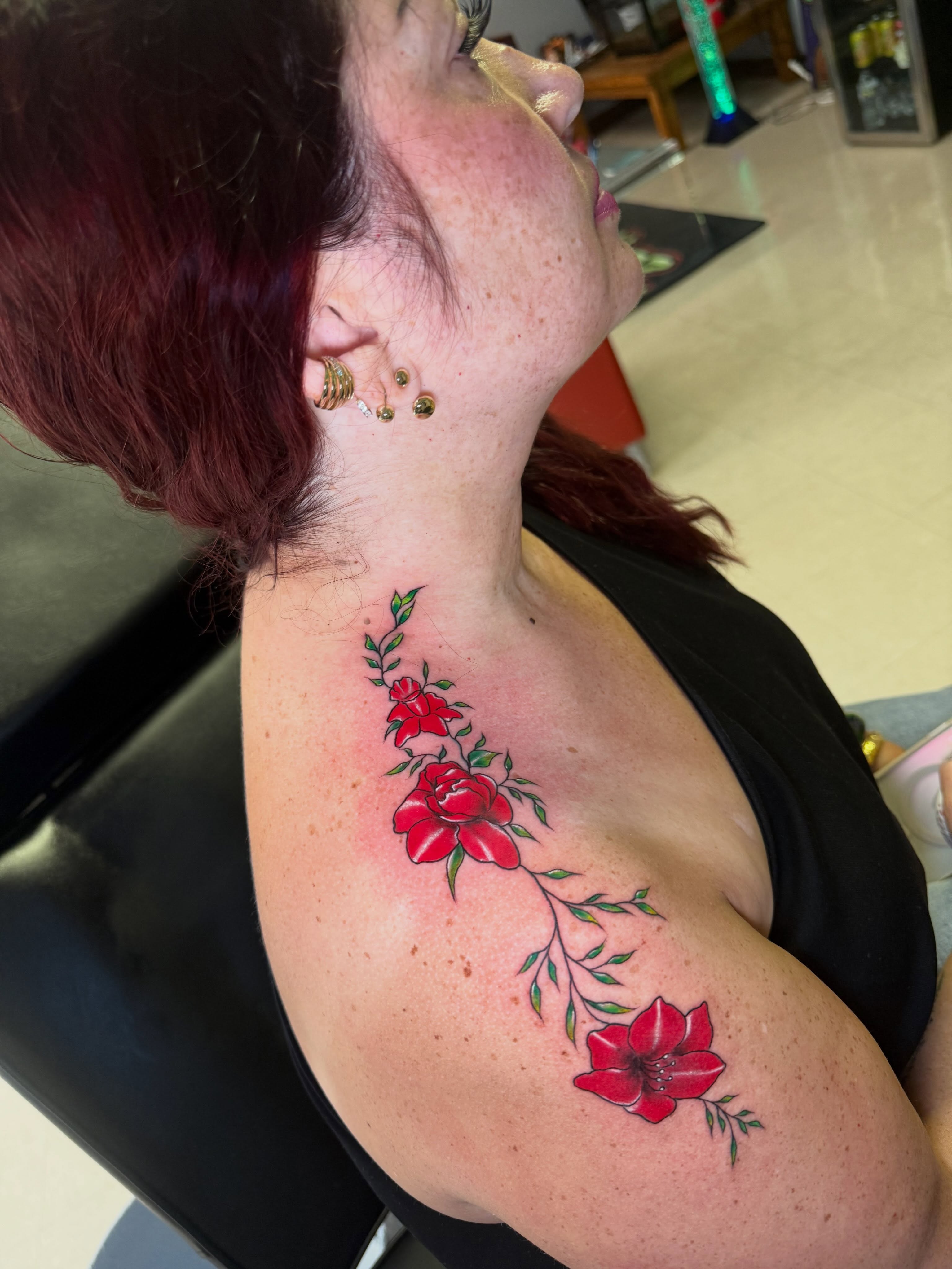 Flowers realism tattoo on the shoulder by Steve - Tattoo Artist