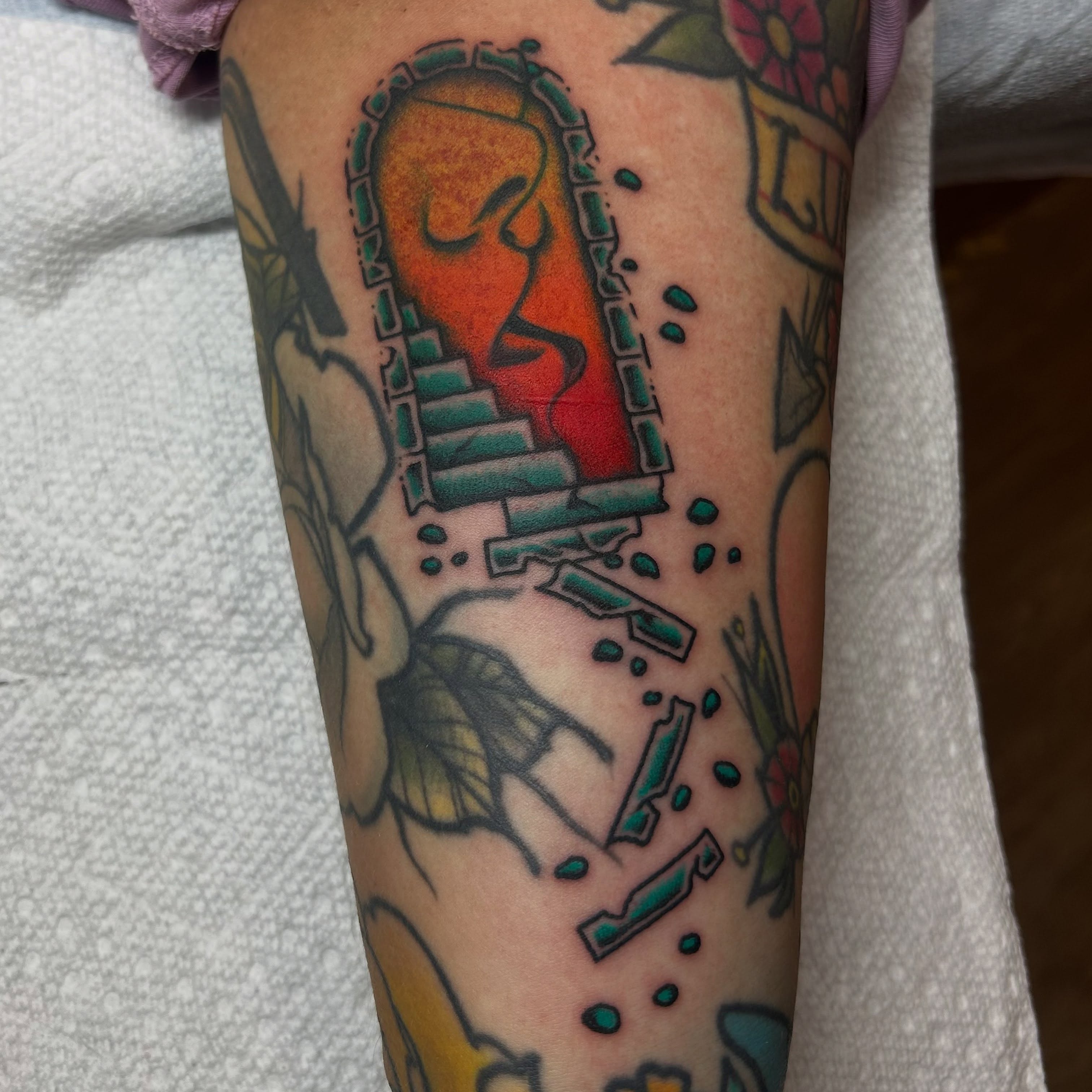 Abstract face geometric tattoo on the forearm by Stephen Sanchez