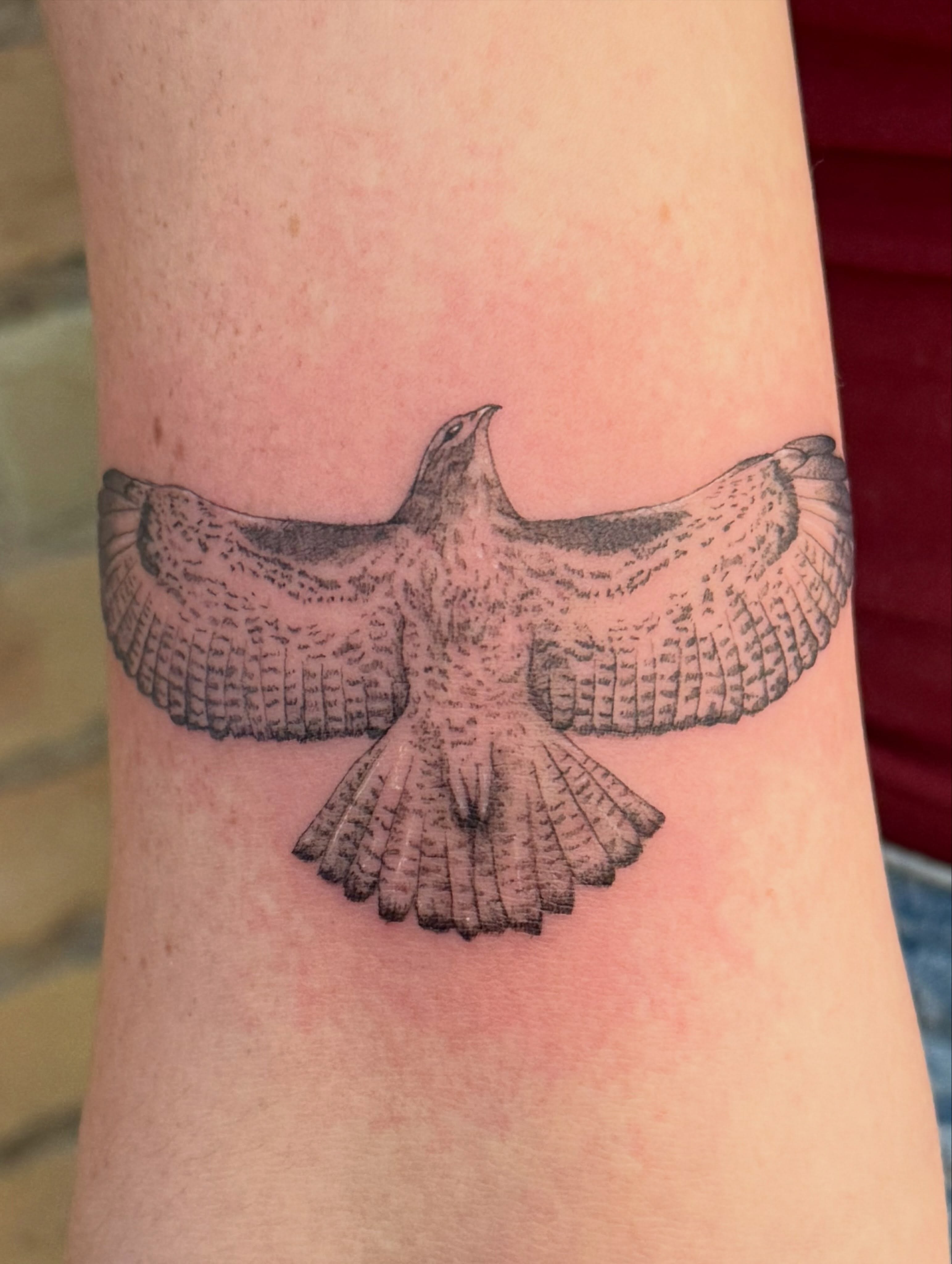 Bird black and grey tattoo on the forearm by Dre
