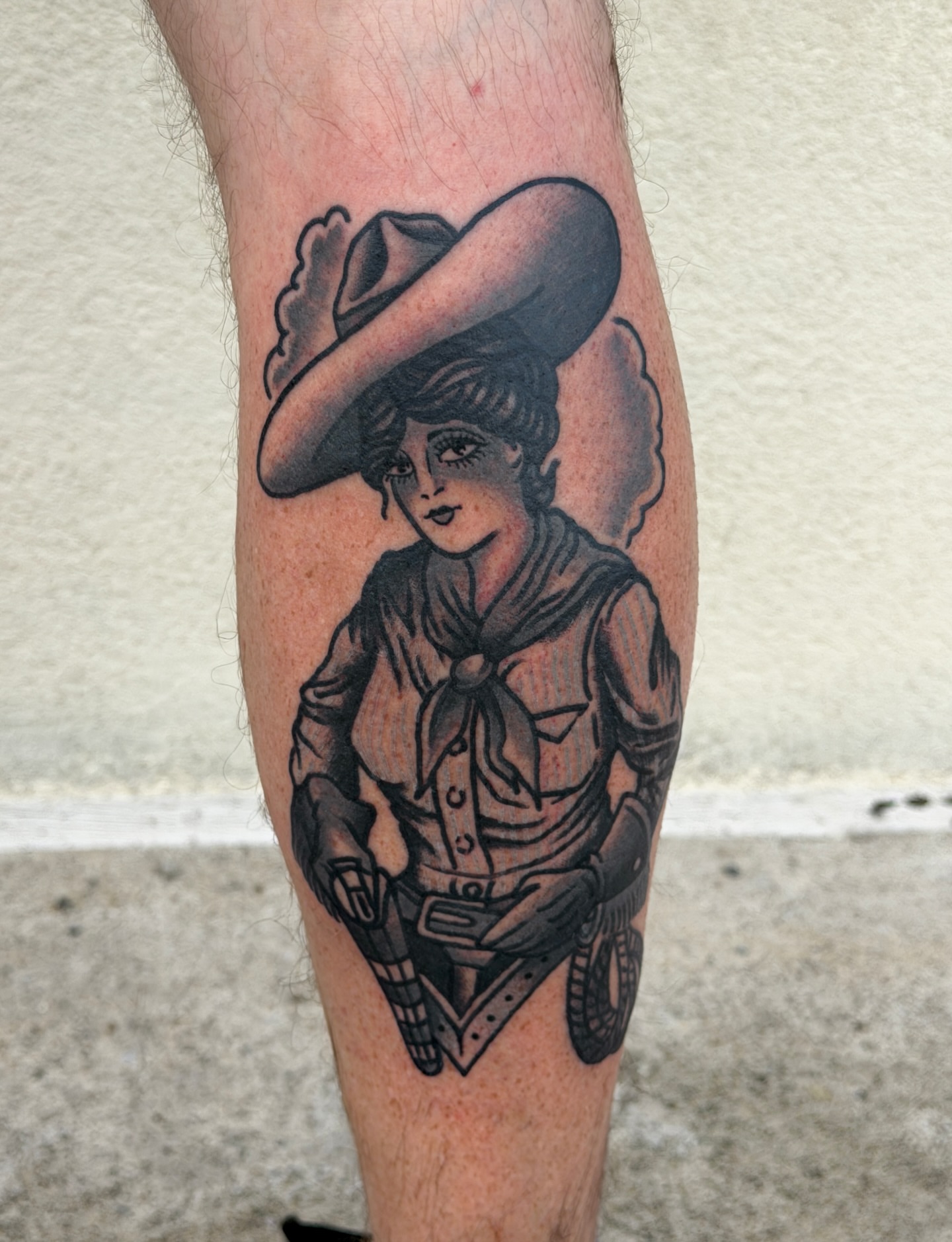 Cowgirl black and grey tattoo on the forearm by Patrick Miller, Huber Heights, Ohio
