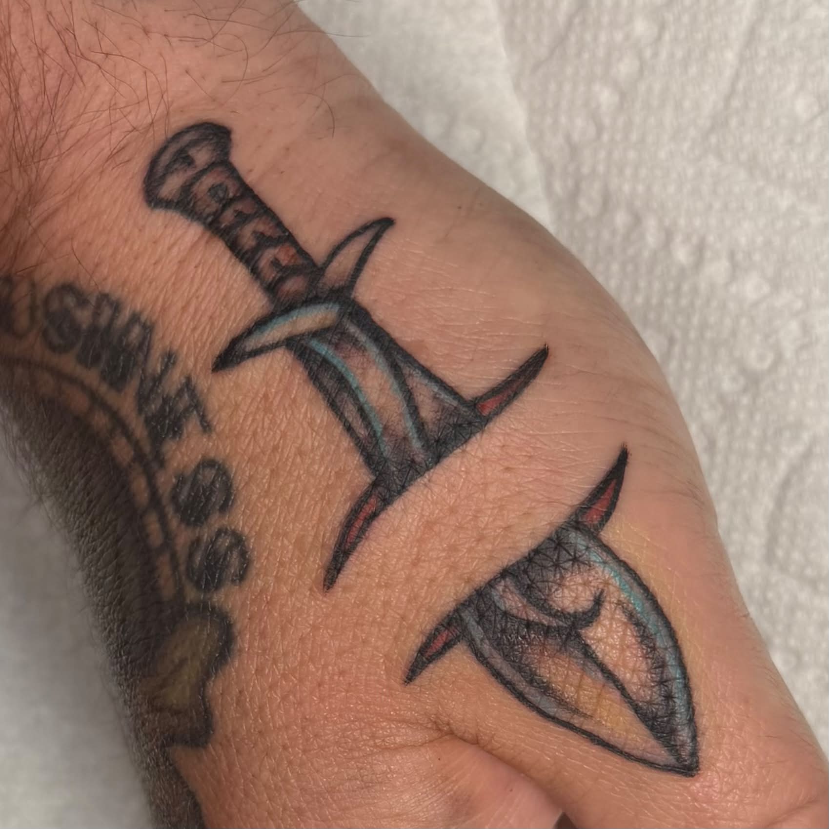 Sword American traditional tattoo on the forearm by Kenneth Prince
