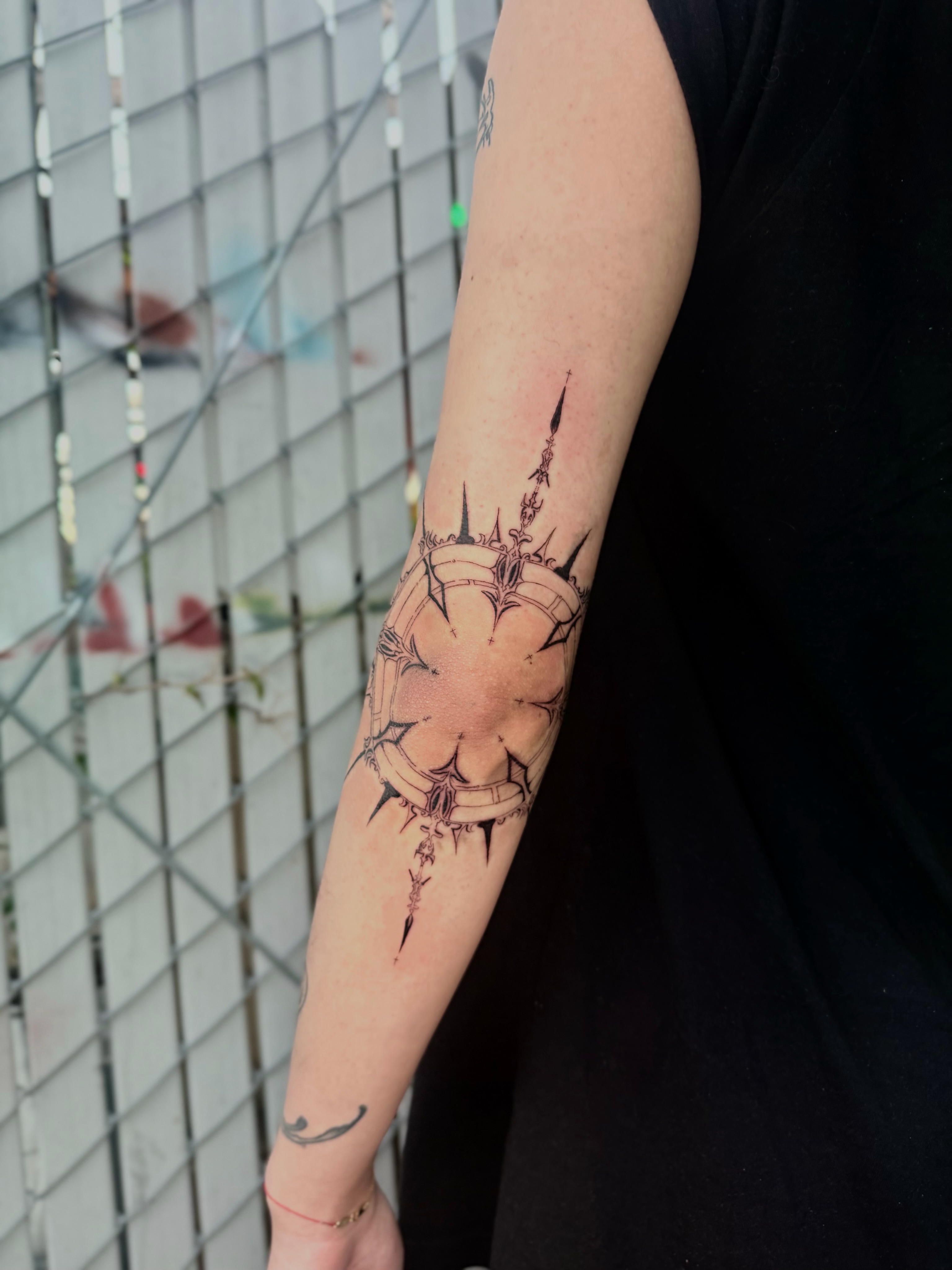 Crown of thorns black and grey tattoo on the forearm by Bryan Nguyen