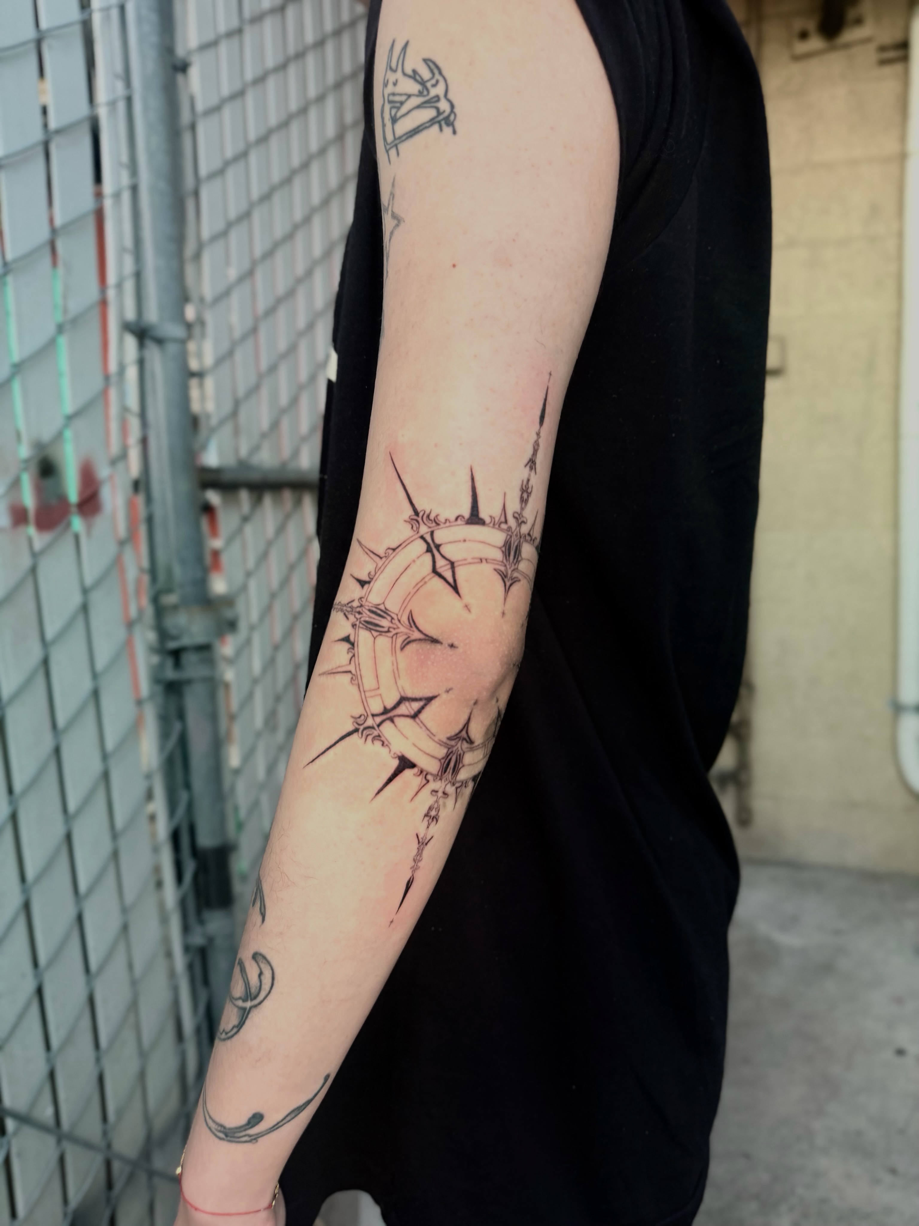 Crown of thorns black and grey tattoo on the forearm by Bryan Nguyen